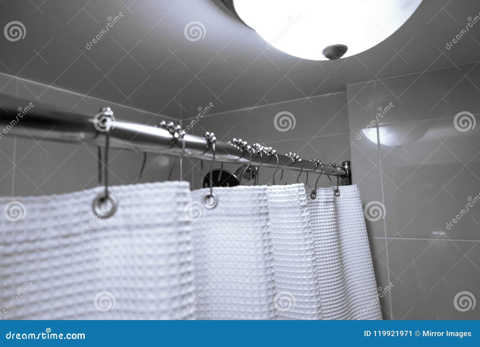 Silver Pole With Roll Ball Shower Curtain Rings Hooks Stock Image