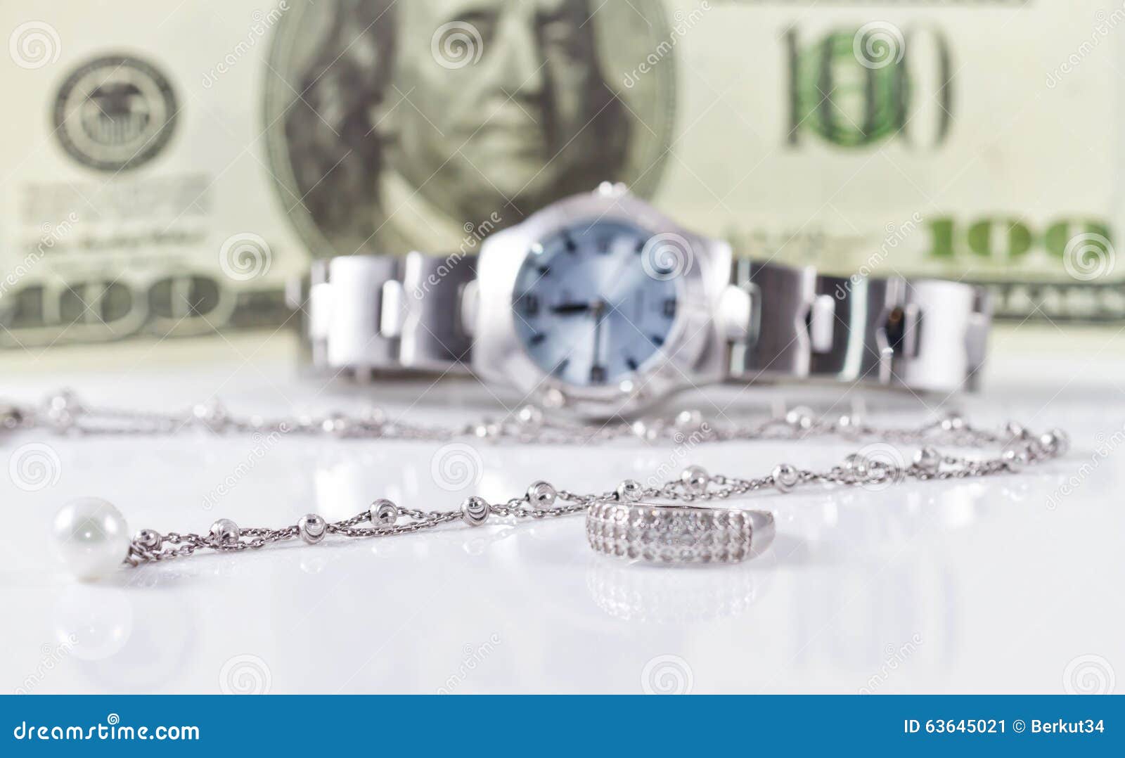 Silver Ring and Chain on the Background of Watches Stock Image - Image ...