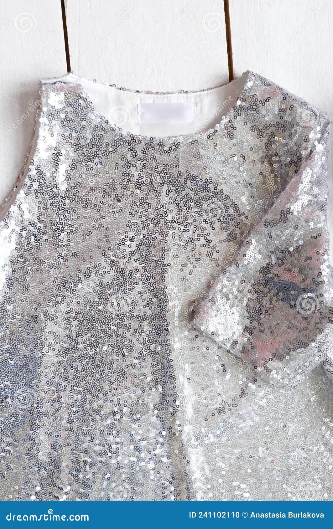 Silver Sequin Fabric Dress with One Sleeve for Girl on White Wooden ...