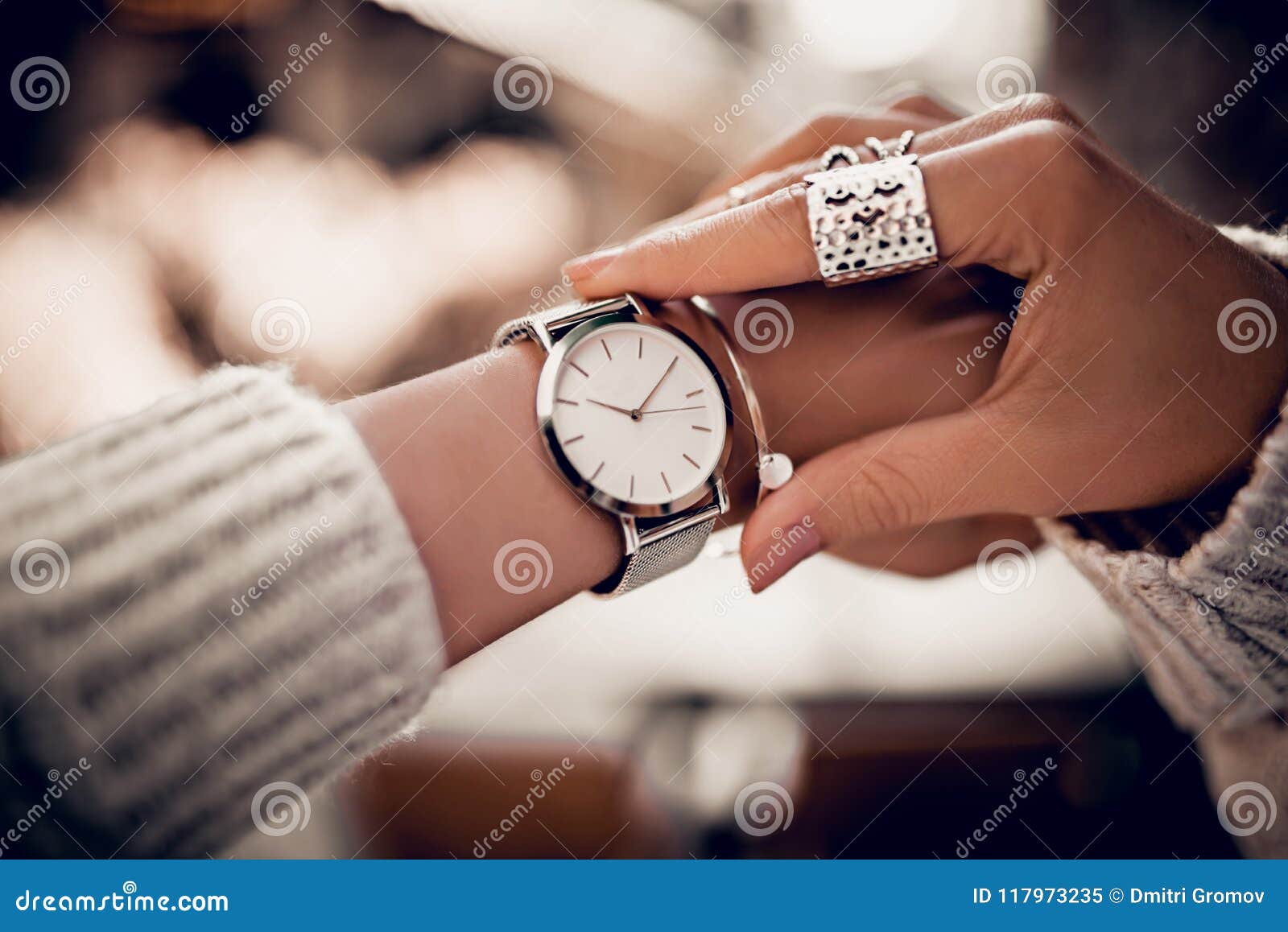 Silver watch on woman hand stock image. Image of spring 117973235