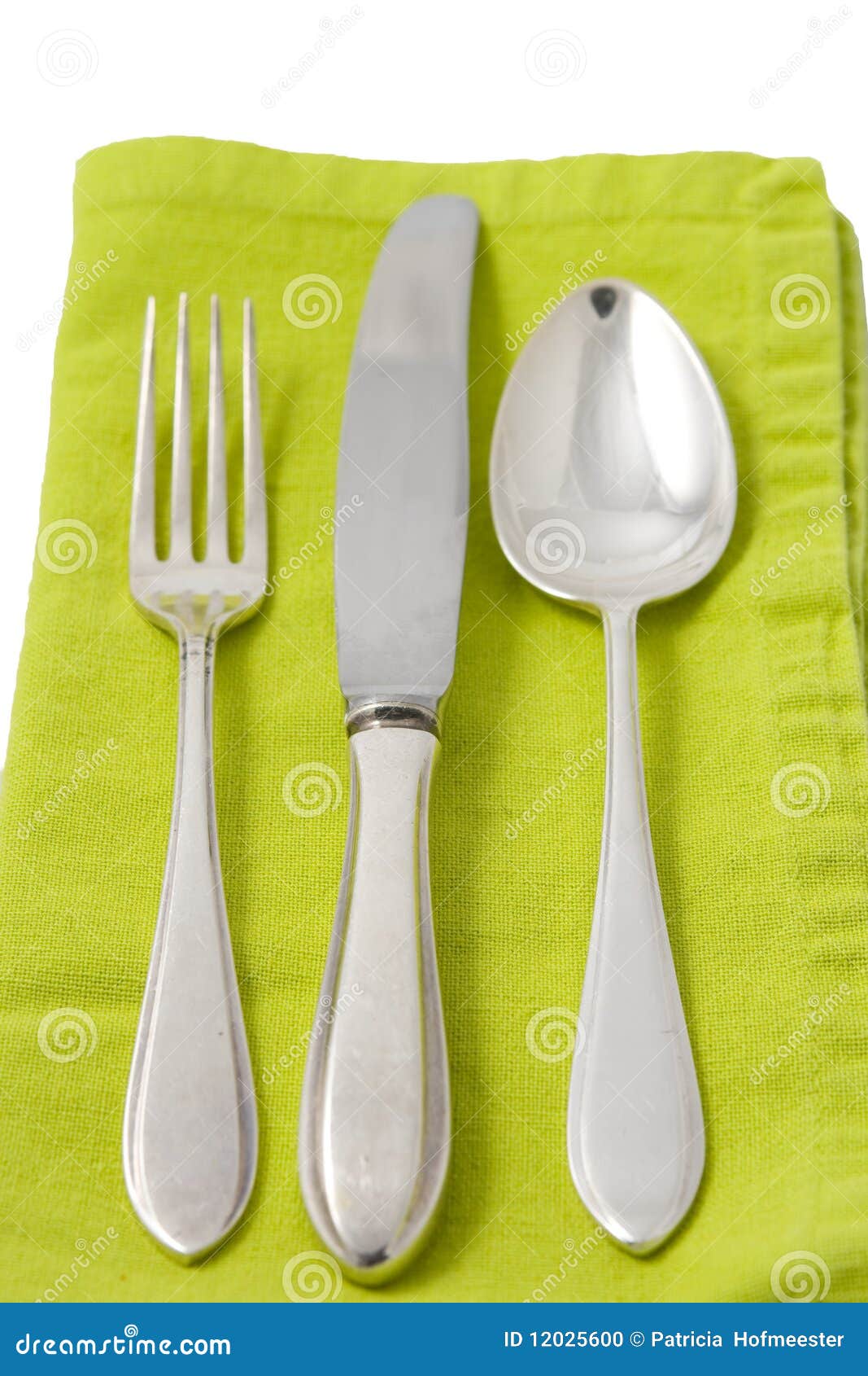 Silverware on green napkin stock photo. Image of linen 12025600