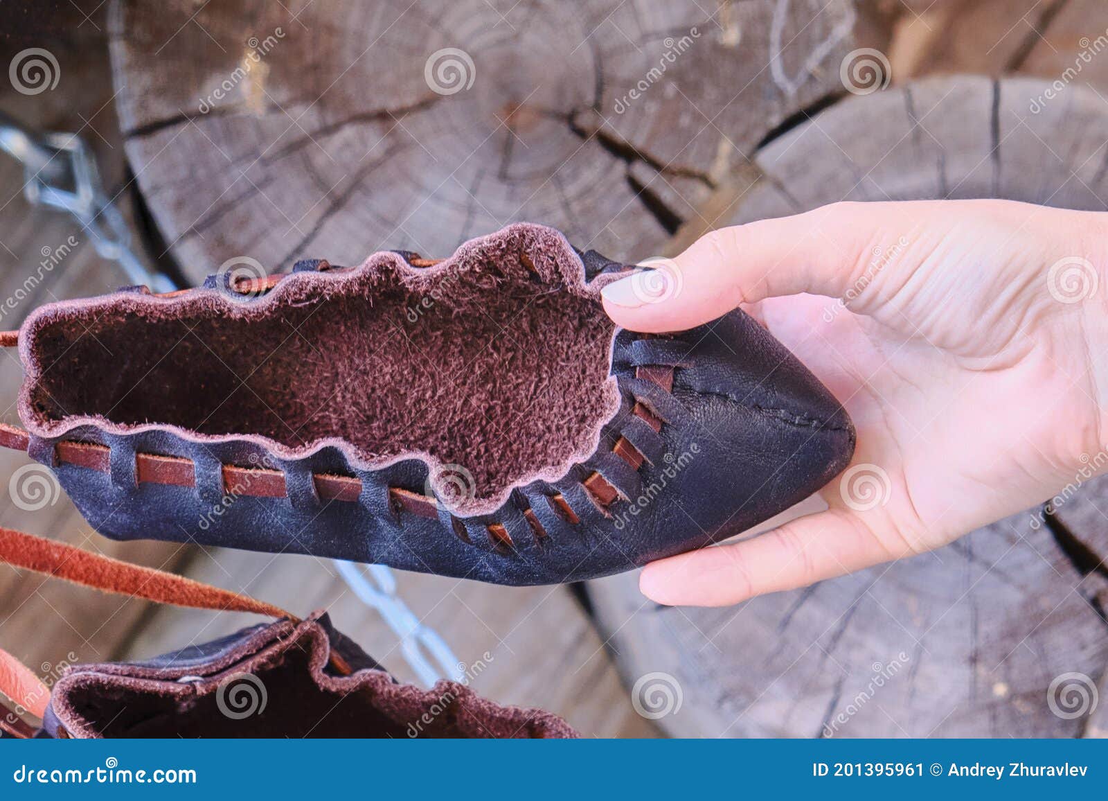 A Simple Black Boot Made of Rough Leather. Shoes in Hand Made of