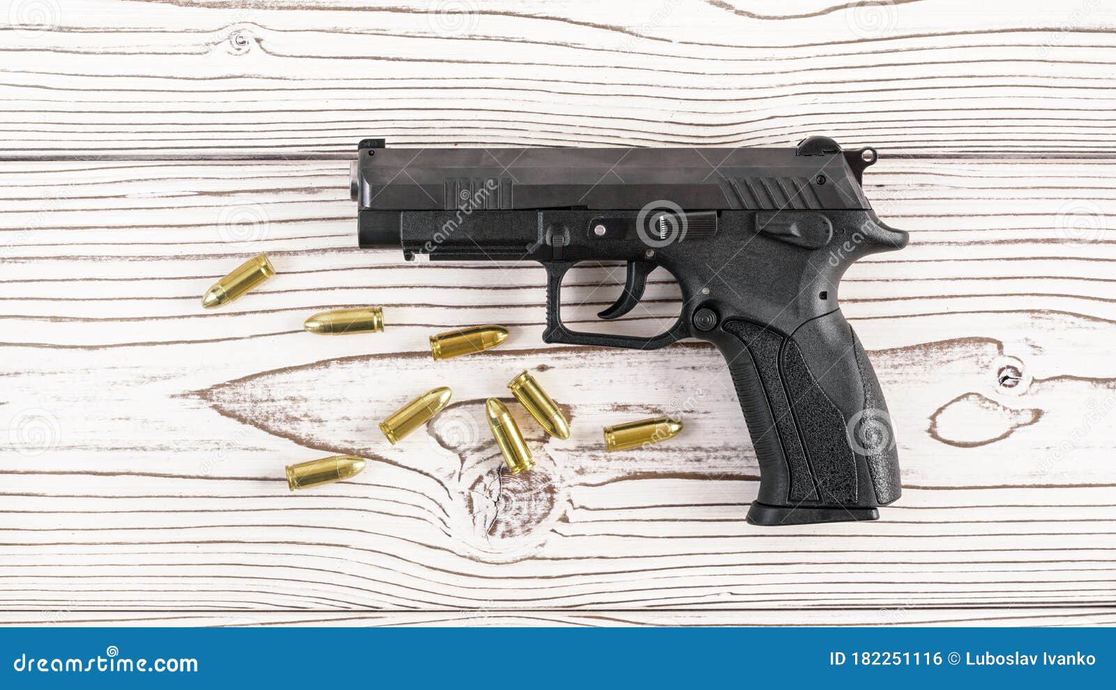 Simple Black Modern Pistol Gun with Few Yellow Brass Bullets on White  Wooden Board, View from Above Stock Photo - Image of design, frame:  182251116