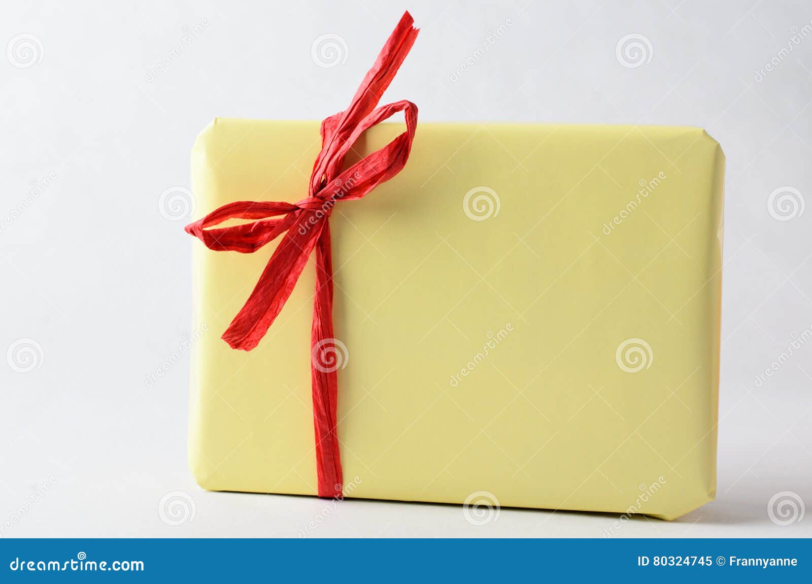 Simple Gift Package in Yellow with Red Raffia Ribbon Stock Image - Image of  copy, generosity: 80324745