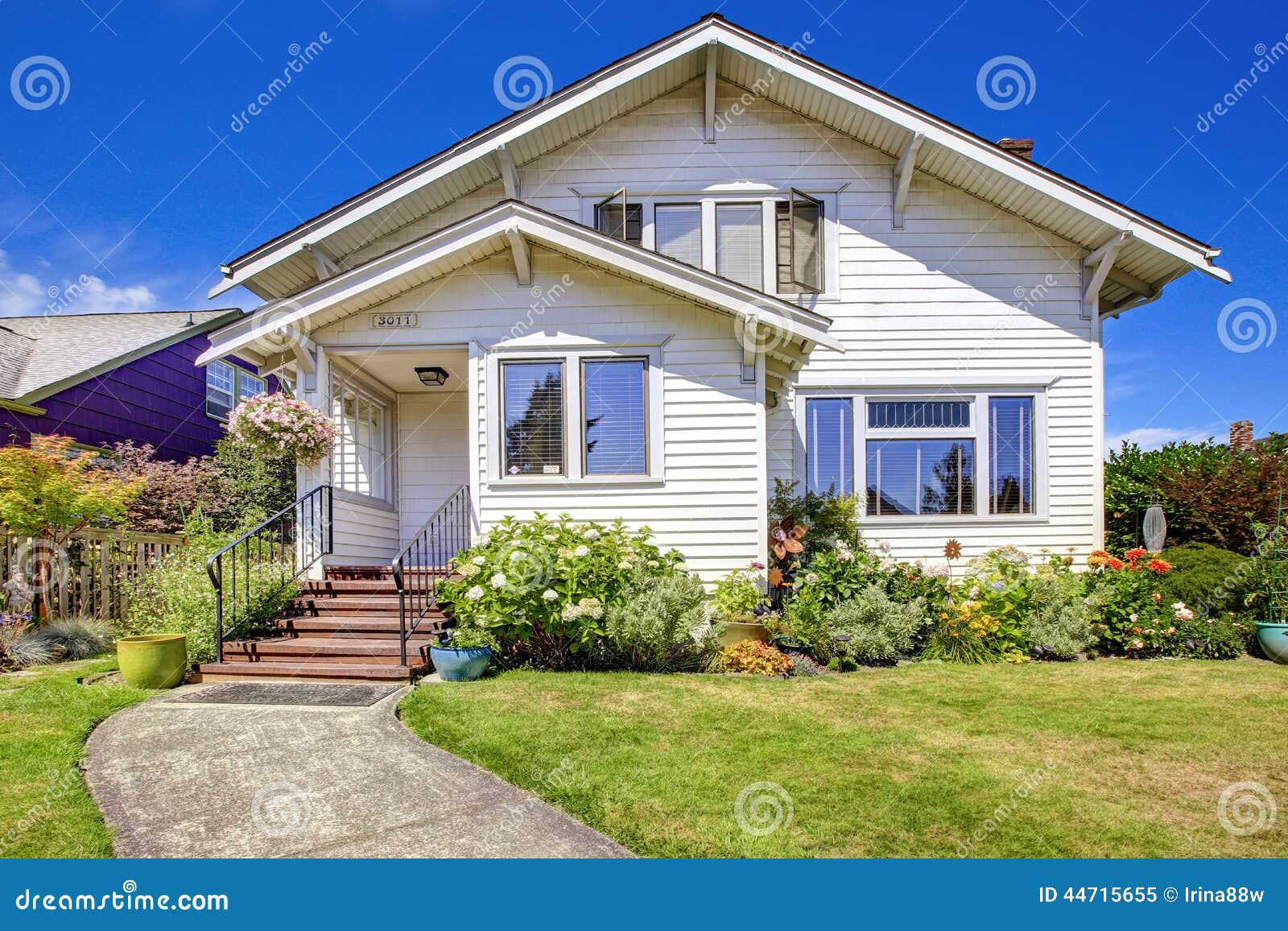 Simple House Exterior. Entrance Porch With Stairs And Flower Bed Stock ...