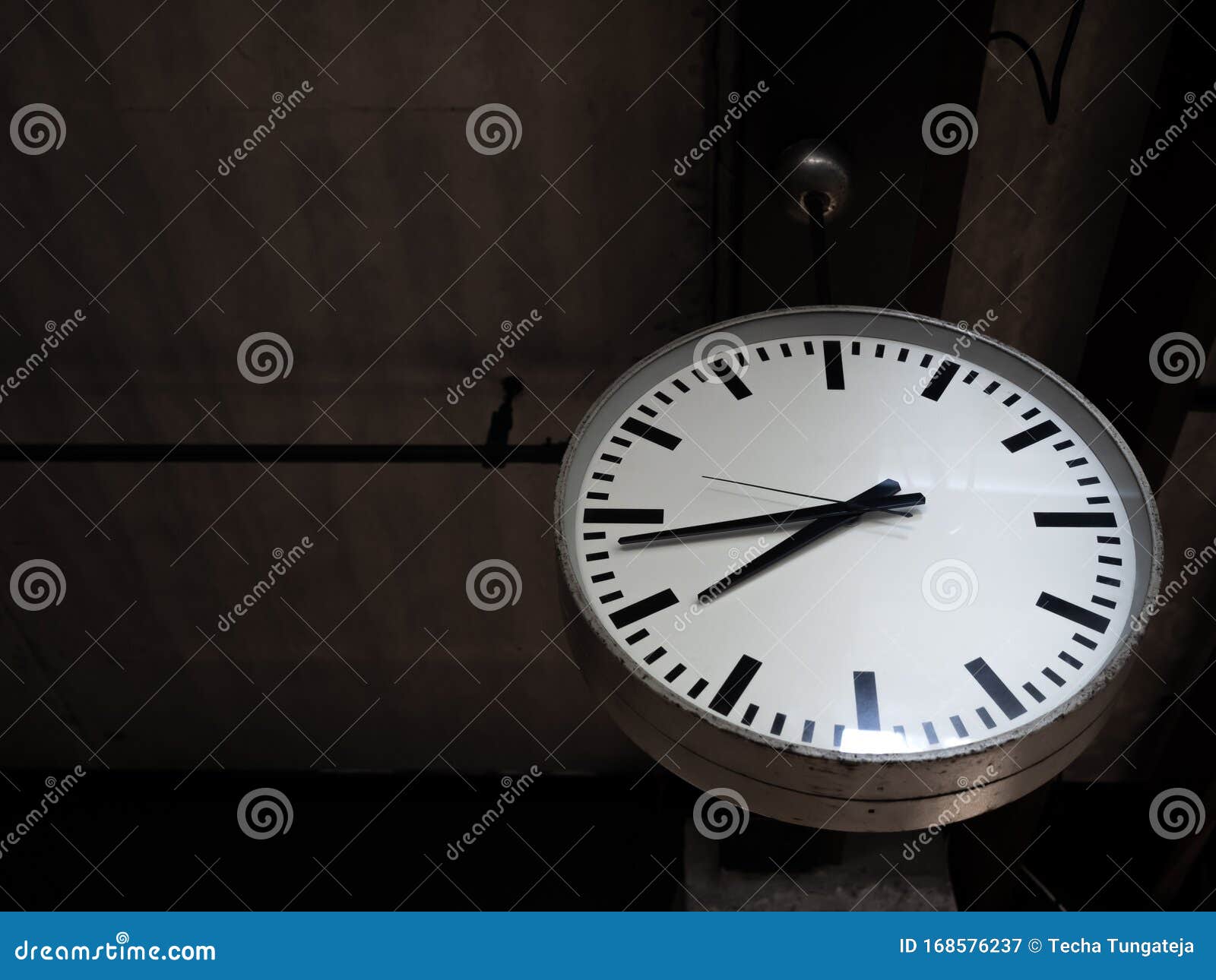 Simple Old Round Clock Hanging From Wooden Ceiling Decoration In