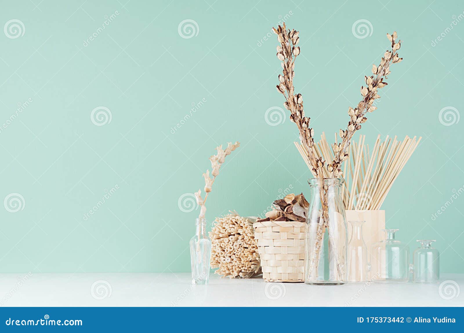 Interior of house of Natural accessories for home decor - dried plants in  glass vase, wicker Stock Photo by andriymedvediuk