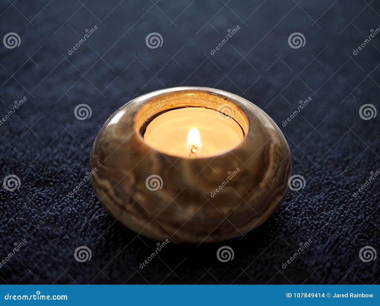 Stone Tea Light Candle Flame on Navy Dark Blue Stock Photo Image of fire, peace 107849414