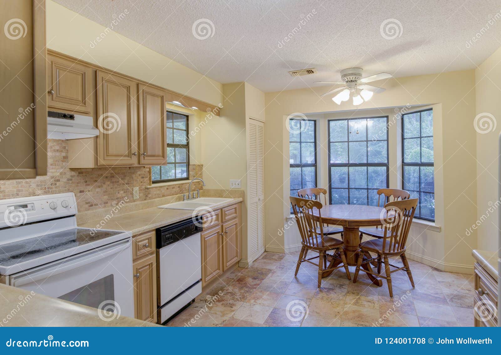 Simple Style Kitchen with Round Eat in Table. Stock Photo Image of