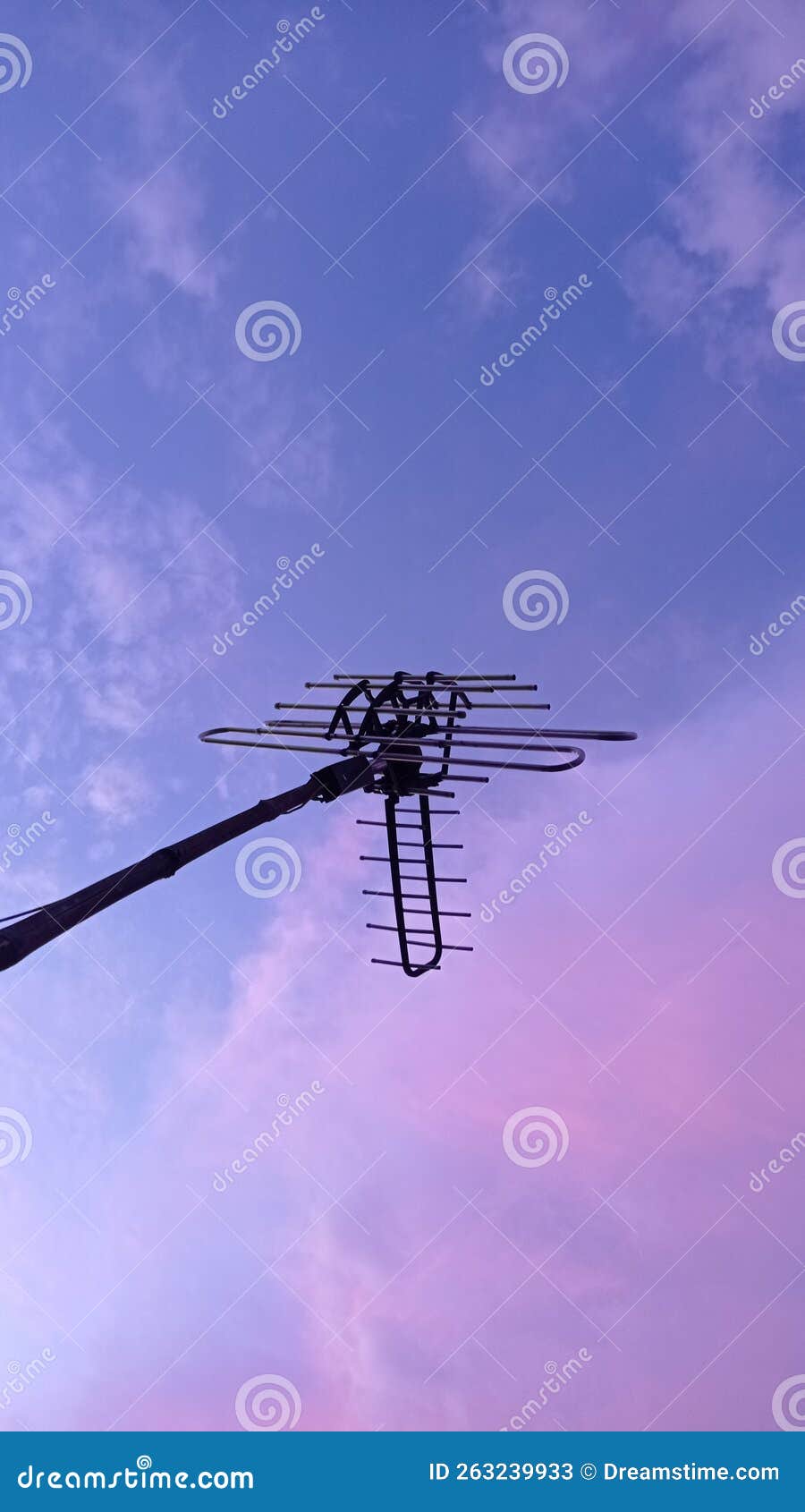 an simple television antenne with aesthetic sky