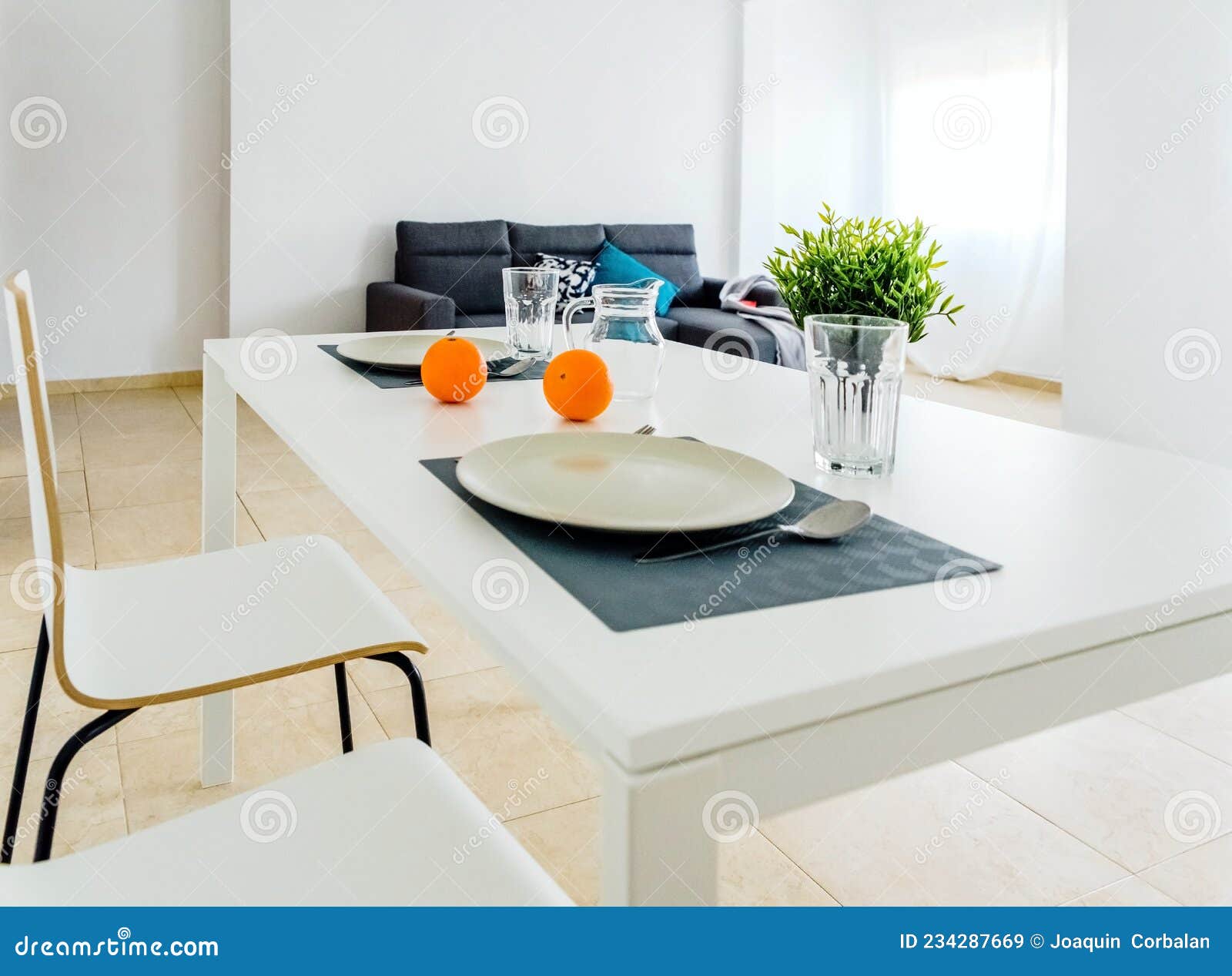 Simple White Table in a Very Simple and Bright Minimalist Living Room