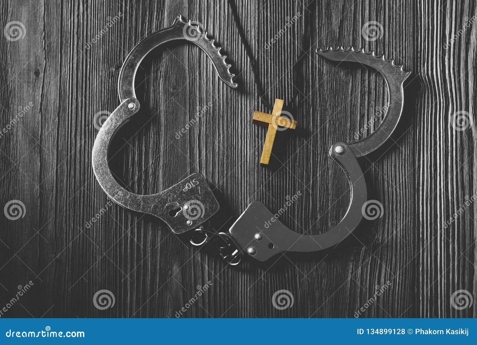 simple wood cross and unchain handcuffs.