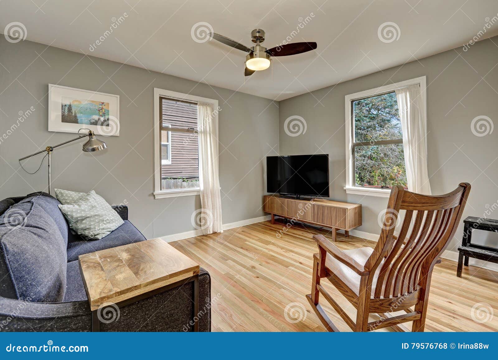 Simplistic Living Room Interior With Light Hardwood Floors Stock