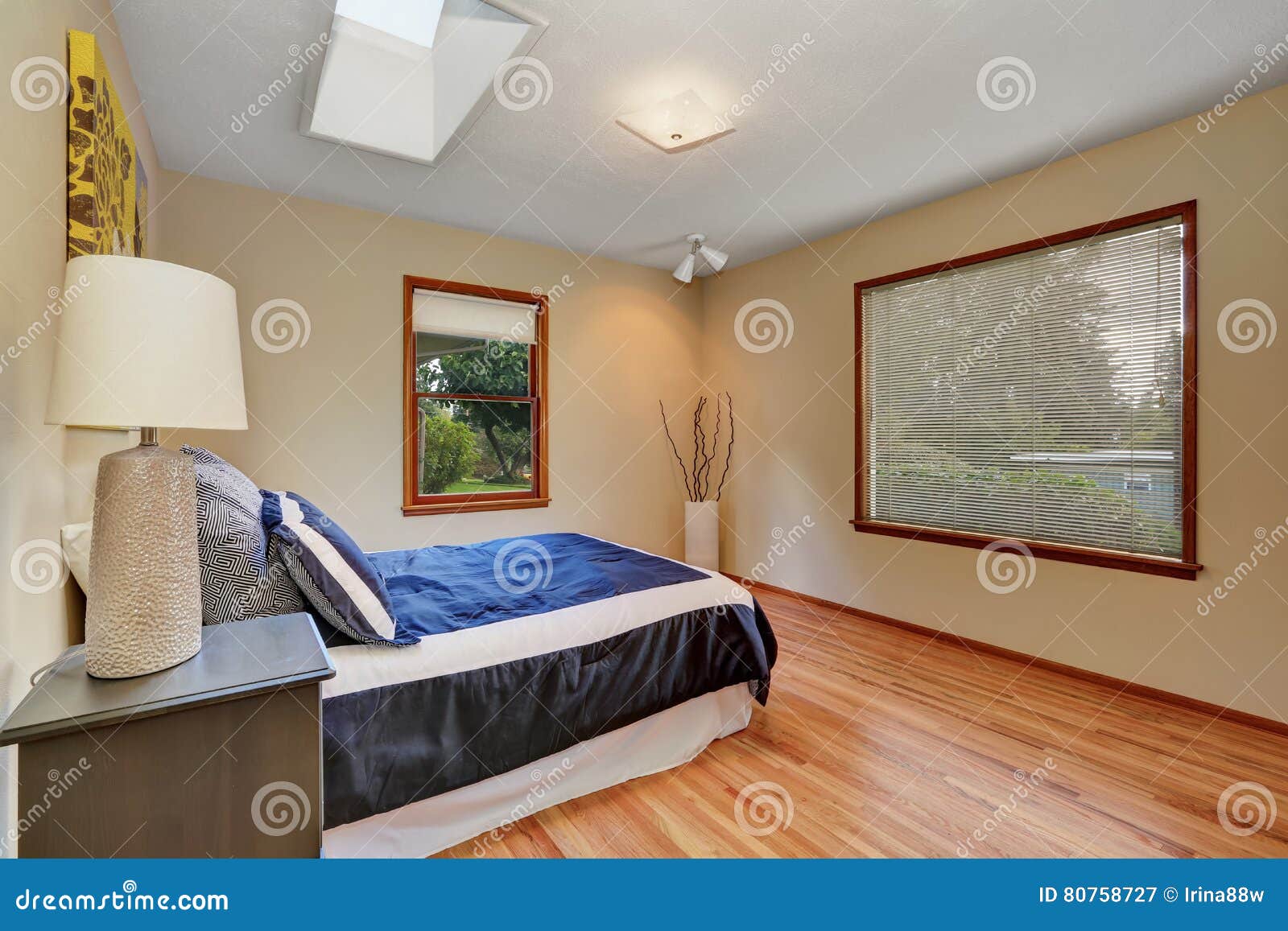Simply Furnished Bedroom Interior With Hardwood Floor Stock Image