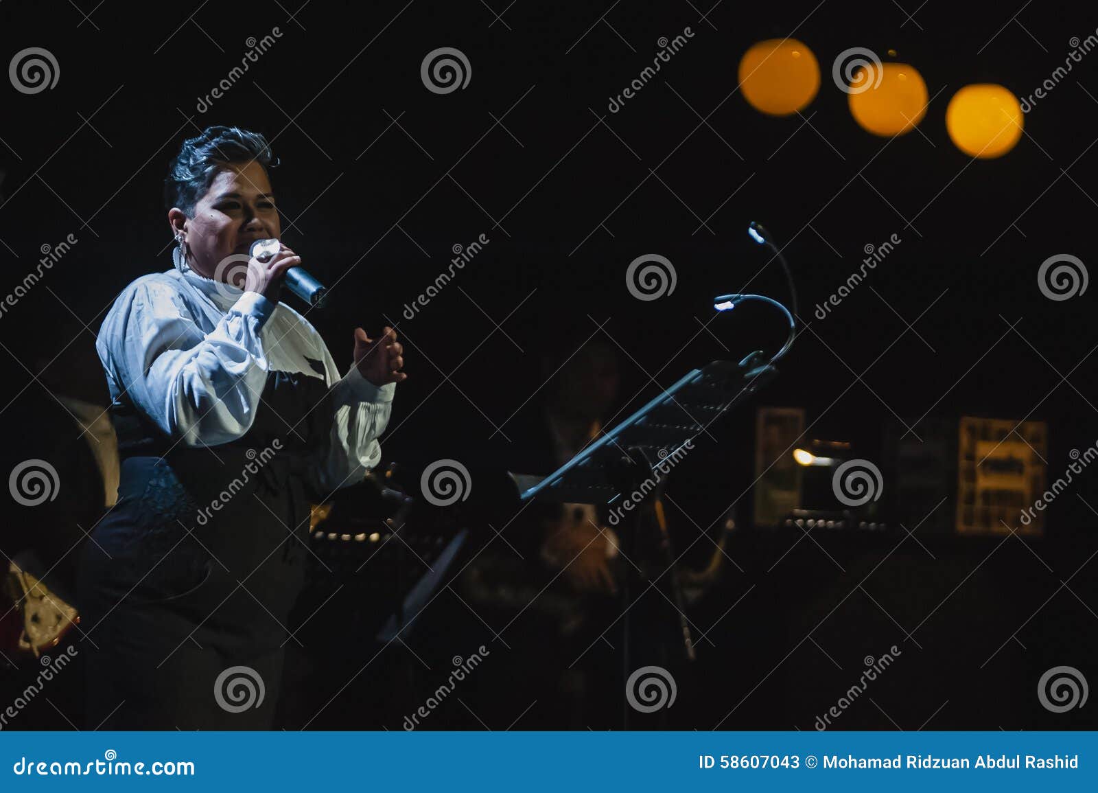 Singing on Stage in Dark Studio Editorial Stock Photo - Image of ...