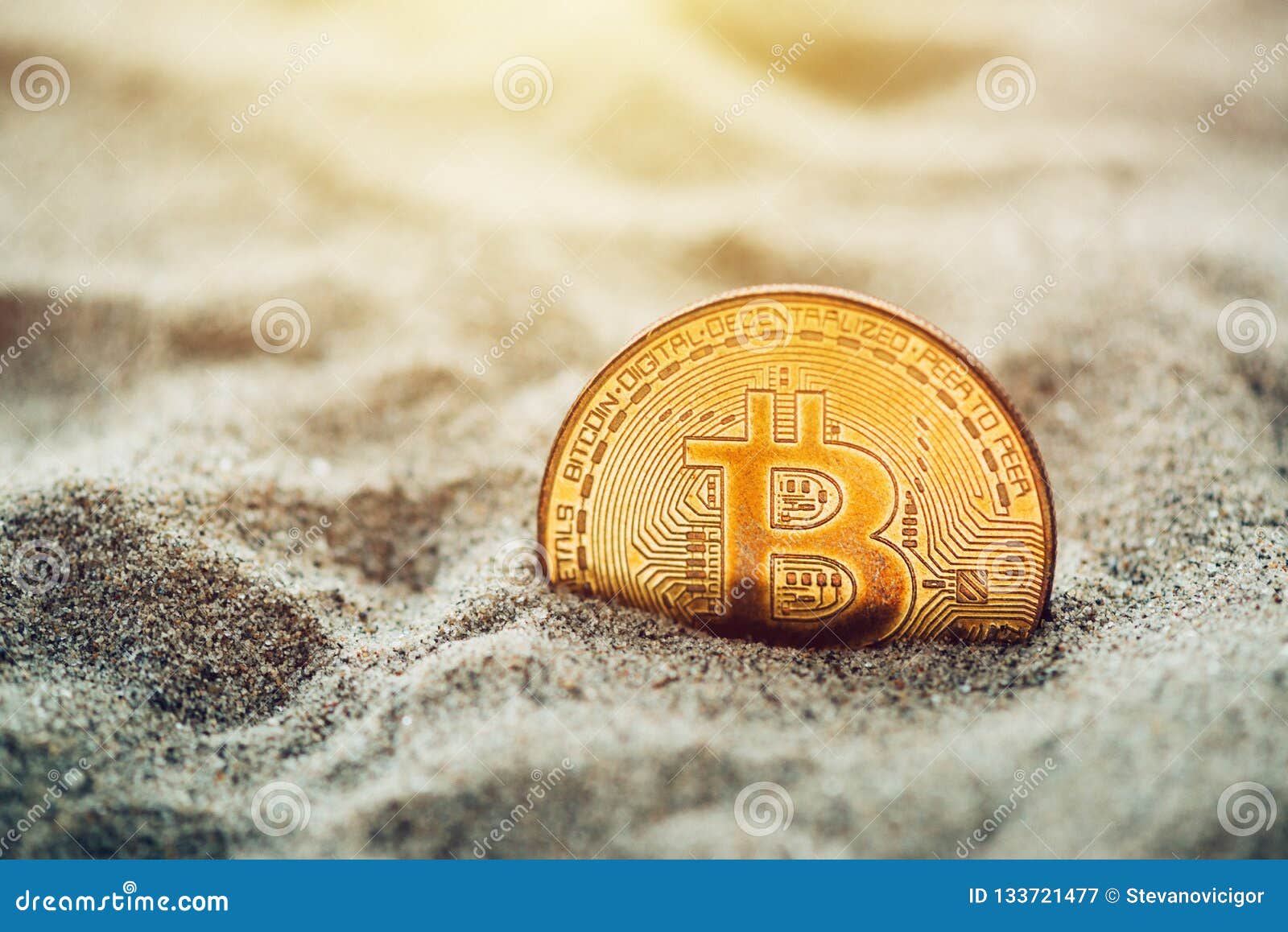 Single bitcoin in sand stock image. Image of buried ...