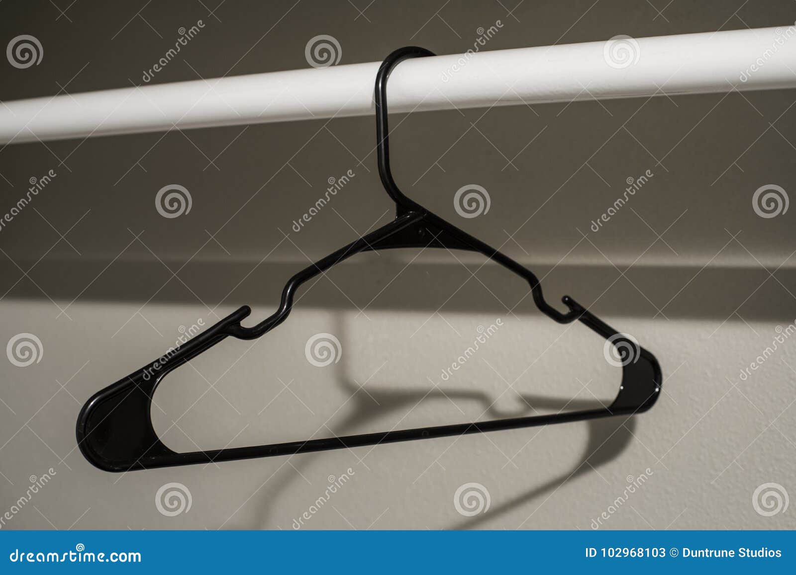 Single Coat Hanger Black stock image. Image of object 102968103