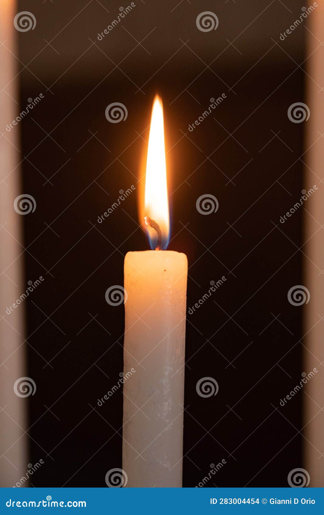 Single Burning Candle in the Foreground Stock Photo Image of ritual
