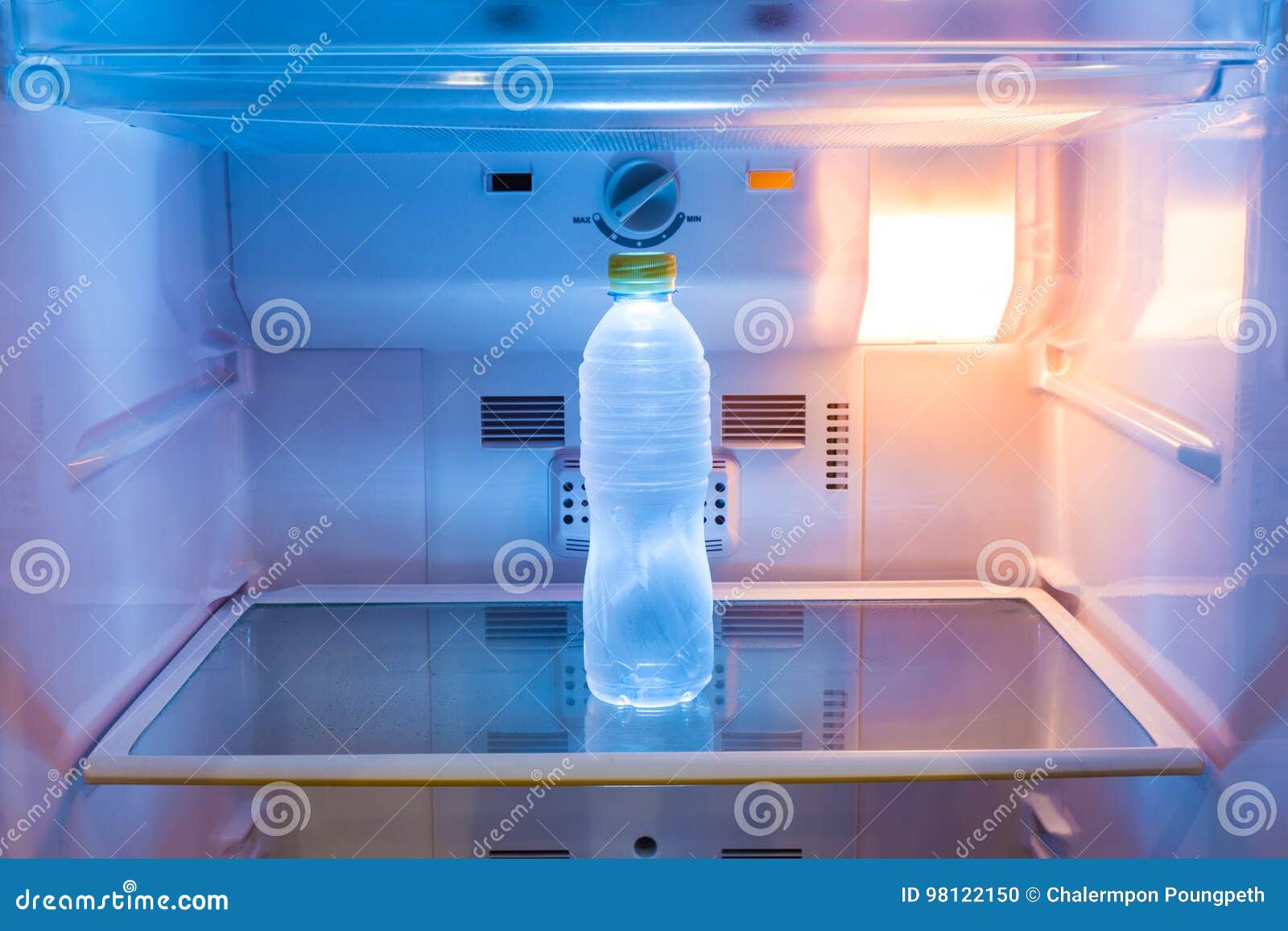 Premium Photo  Cold bottles of clean drinking water in a white refrigerator