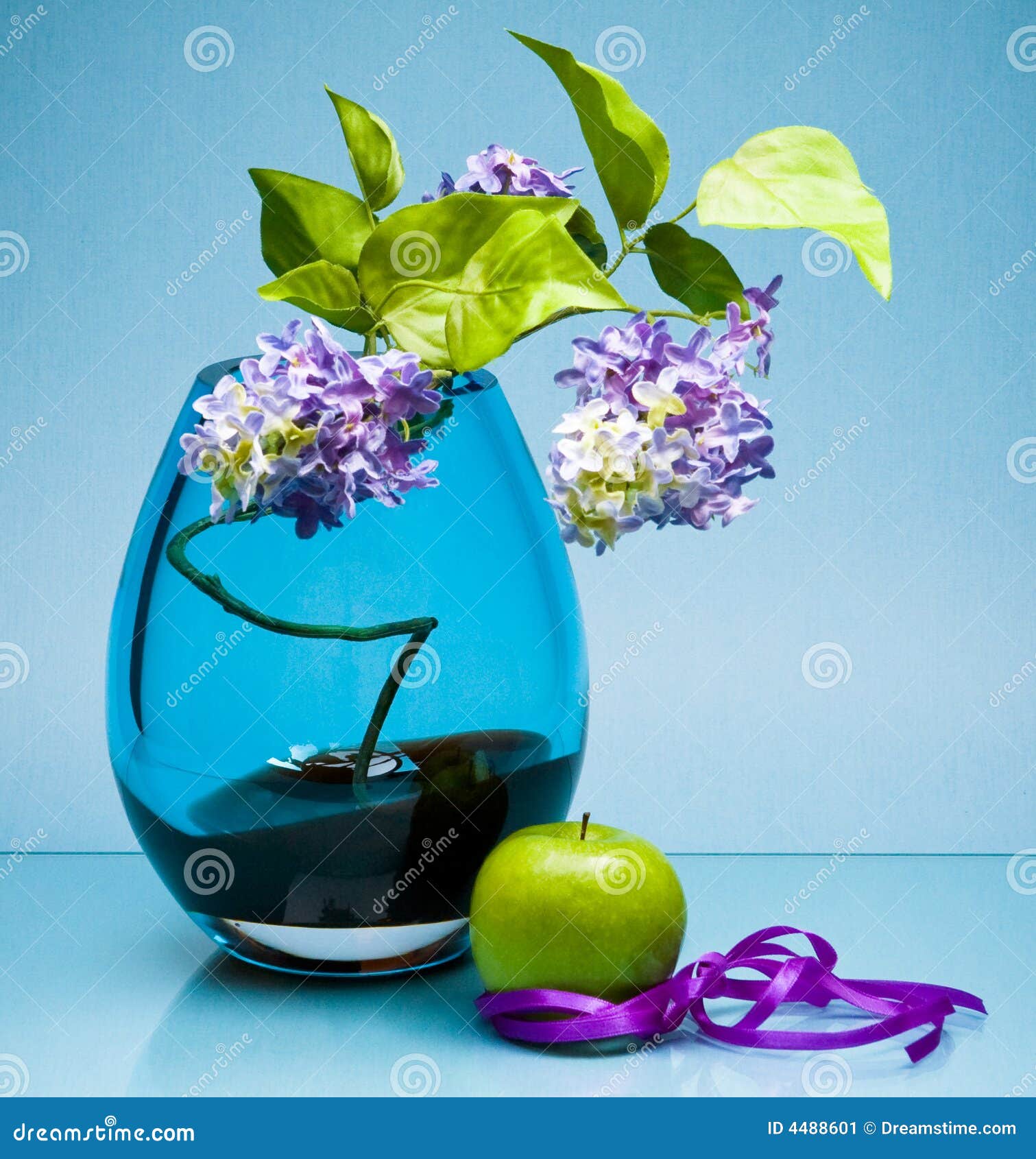 Single Fruit and Flowers in Glass Vase on Blue Stock Image Image of