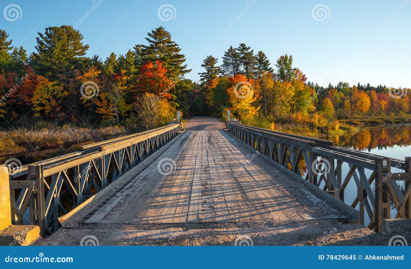 single lane steel and timber bridge over cory lake.