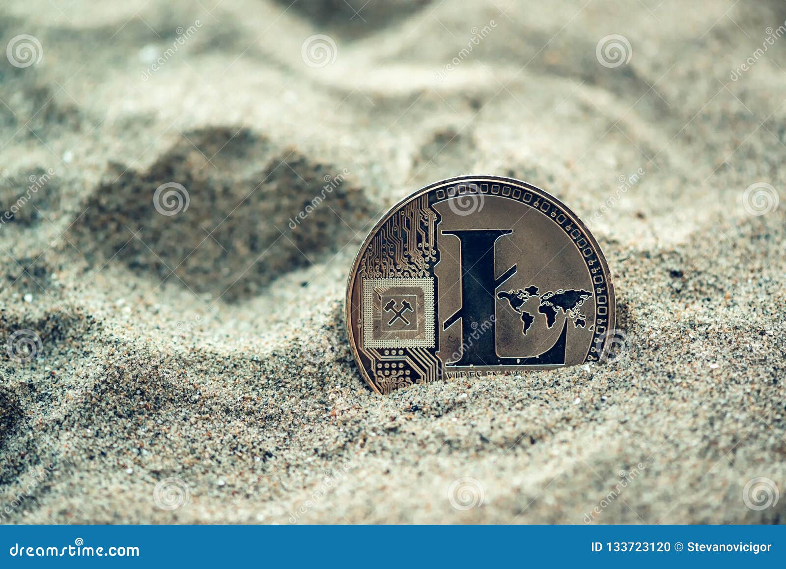 Single litecoin in sand stock photo. Image of found ...