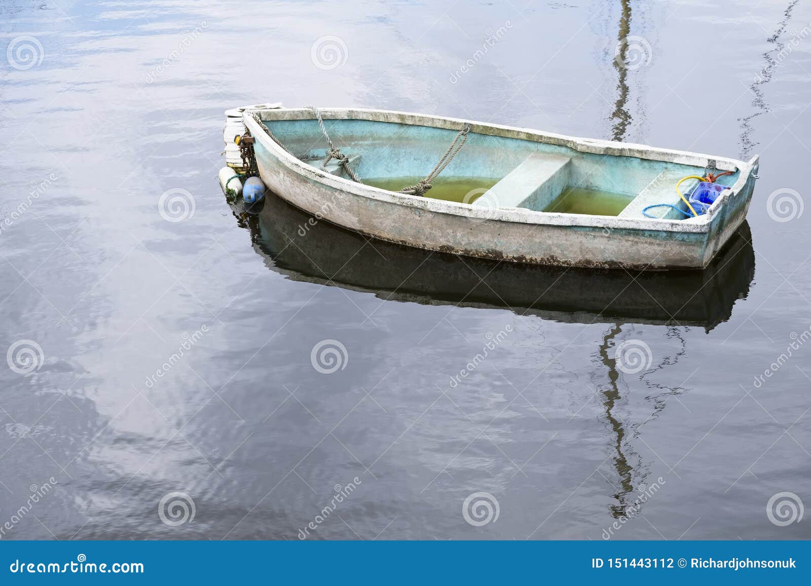 Single Lonely Boat Sinking in Water and Reflection Stock Photo Image