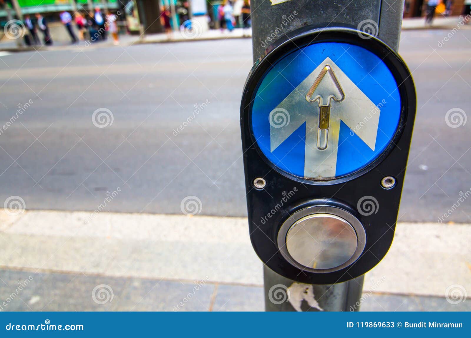 pedestrian crossing control button at intersection.