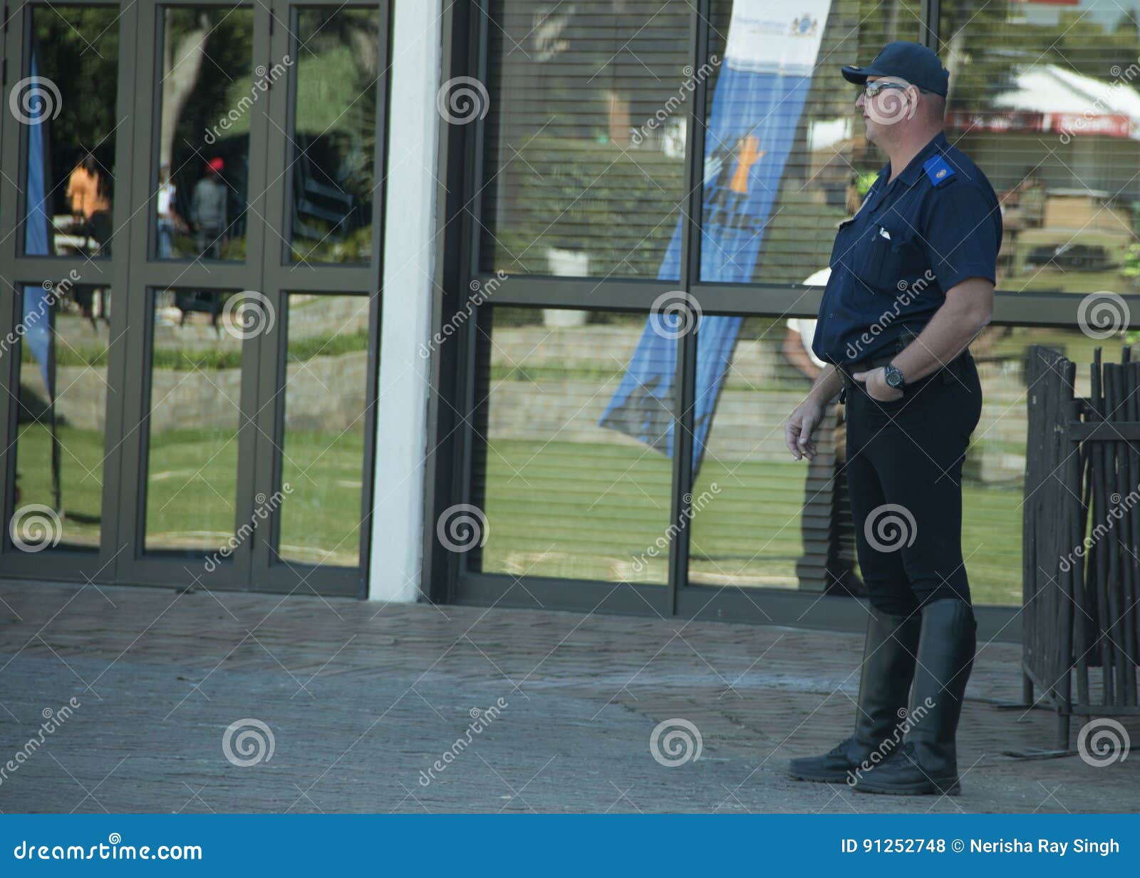 A Single Policeman Standing Alone , Wearing Riding Boots Editorial