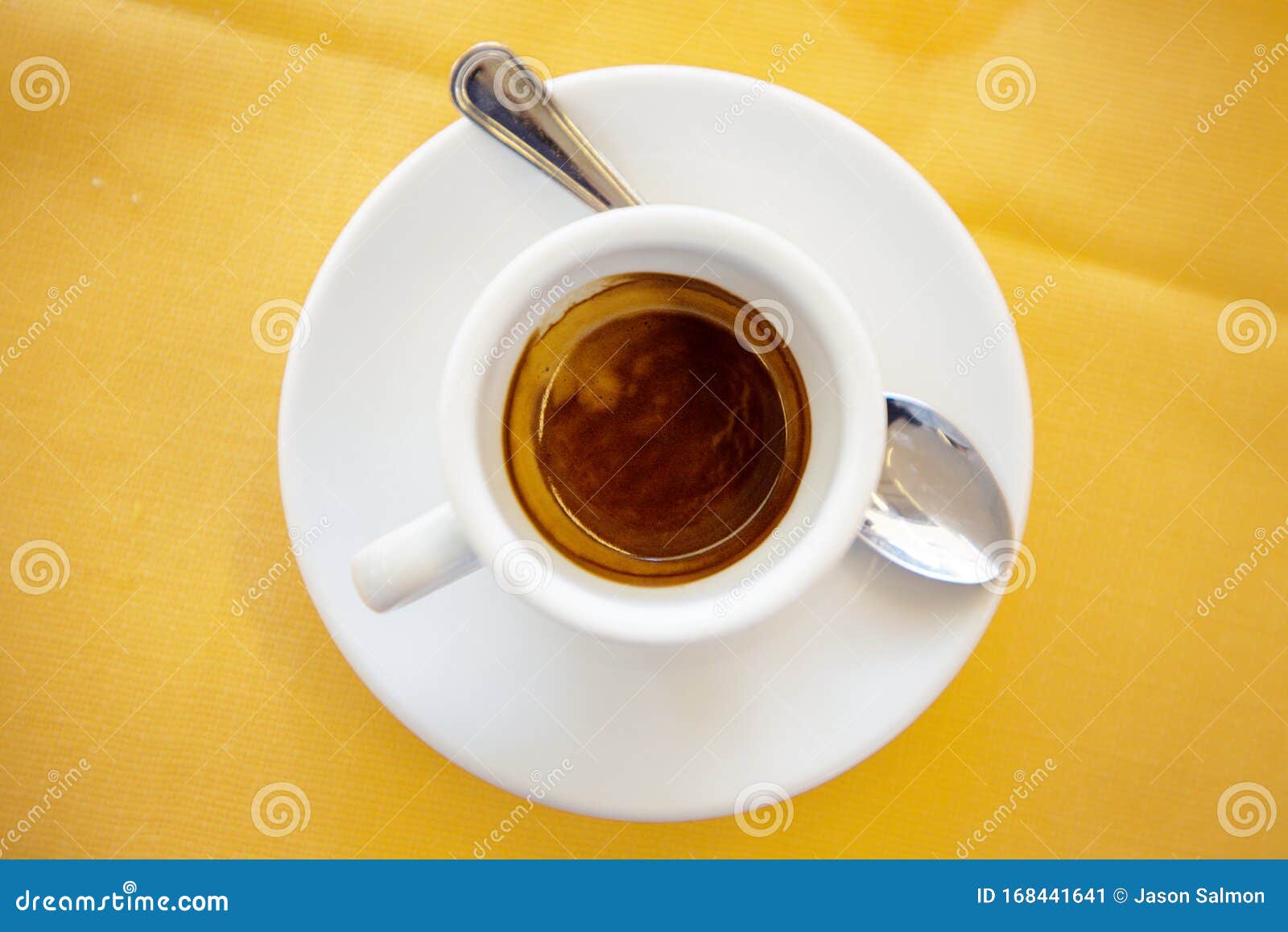 Close-up of espresso coffee in a single shot glass cup with saucer