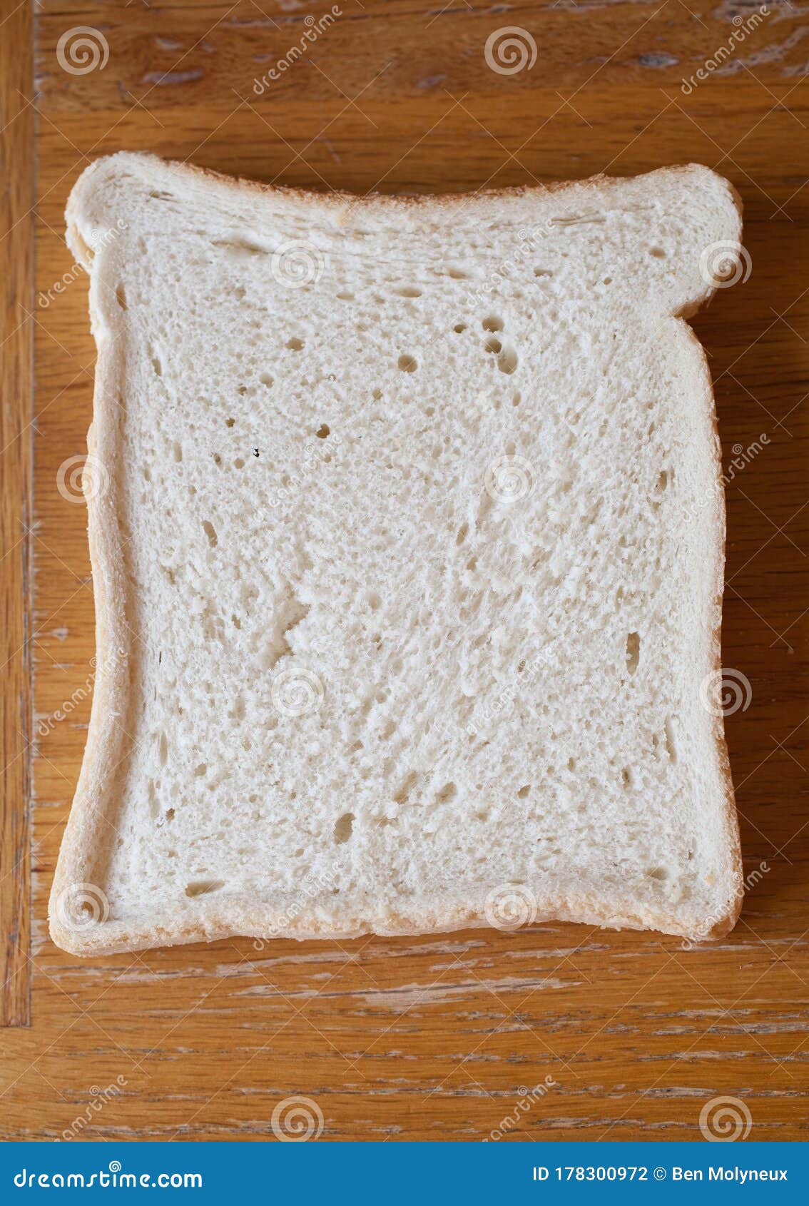 a slice of white bread on a kitchen table