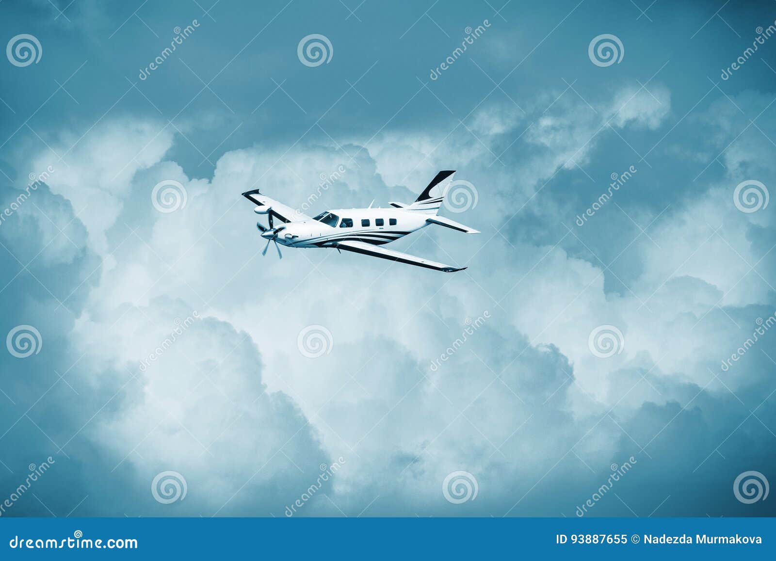 Single Turboprop Aircraft.. Small Private Plane Flying In Blue Clouds ...