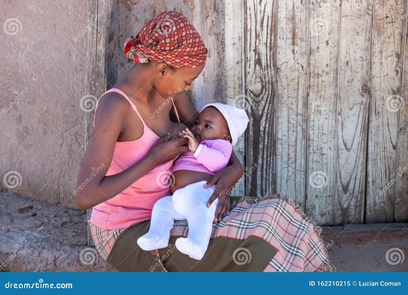 African Mother Breastfeeding Stock Image - Image of 