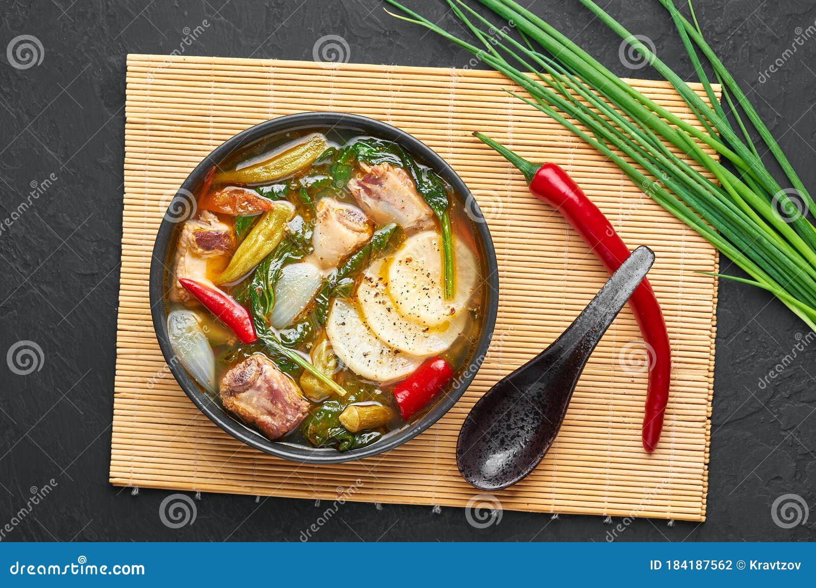 Sinigang Na Baboy Dish or Filipino Pork Meat Soup in Black Bowl on Dark ...
