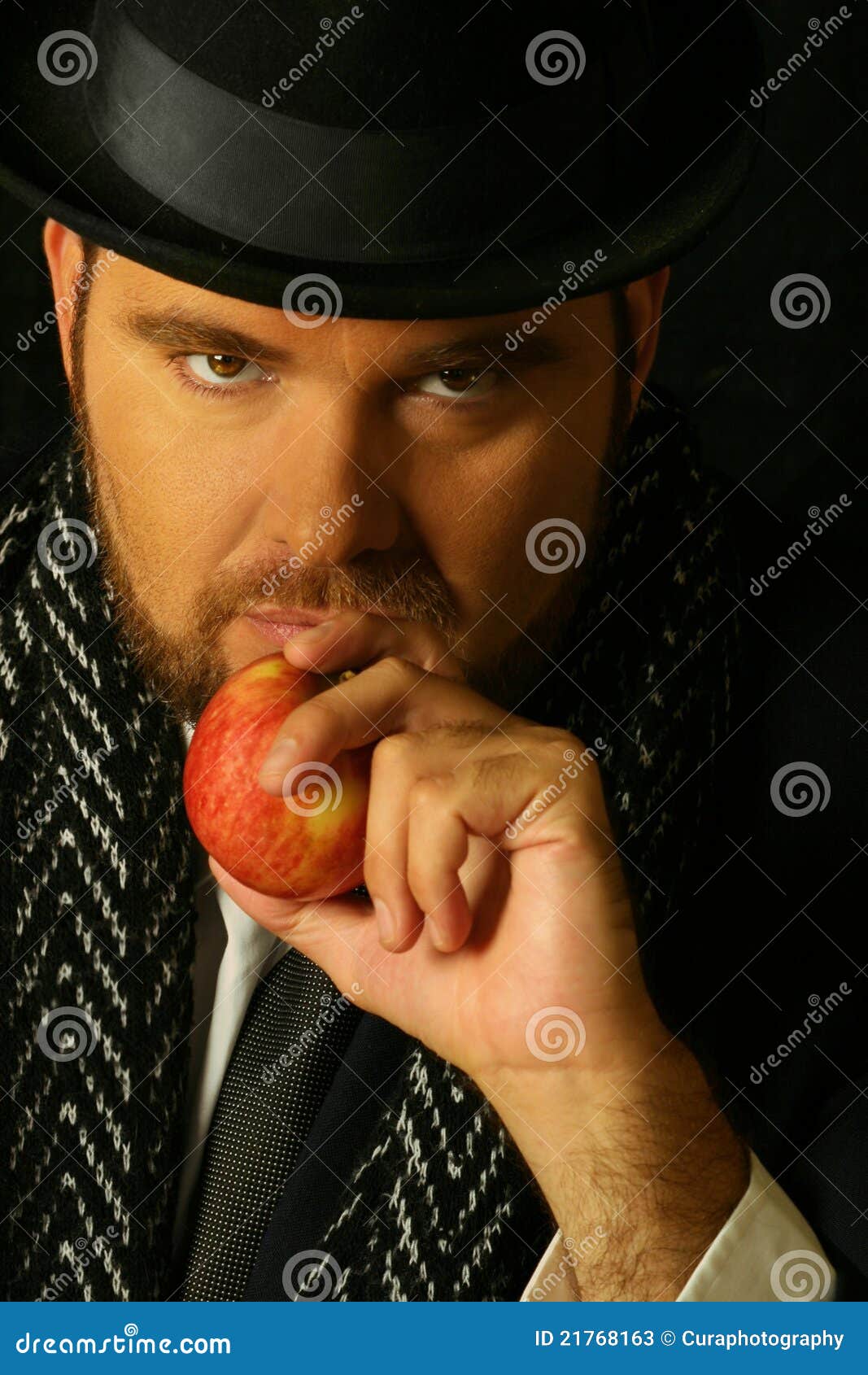 sinister man with apple