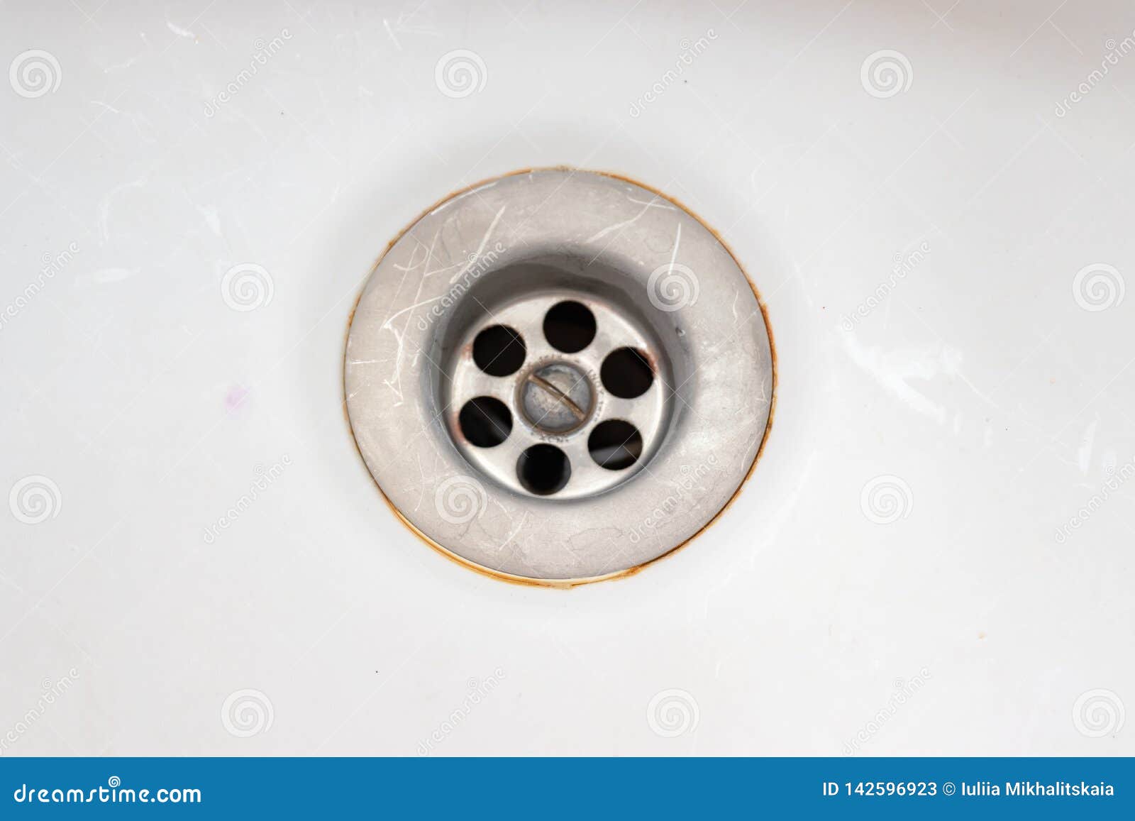 A Sink Drain Hole With Limescale Or Lime Scale And Rust On It