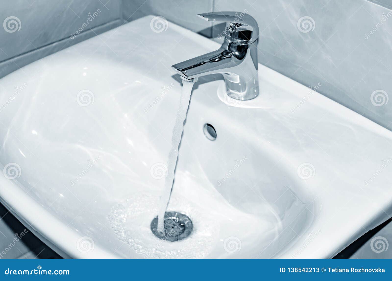 beads of water on bathroom sink