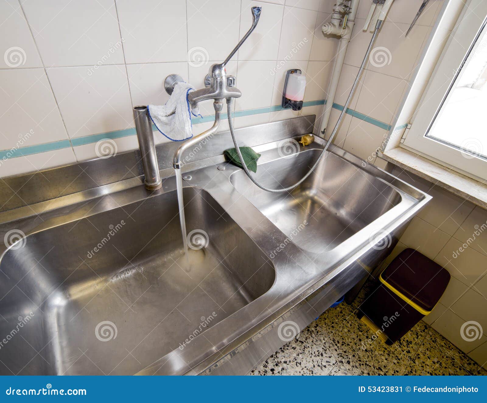 sink stainless steel industrial kitchen with open tap