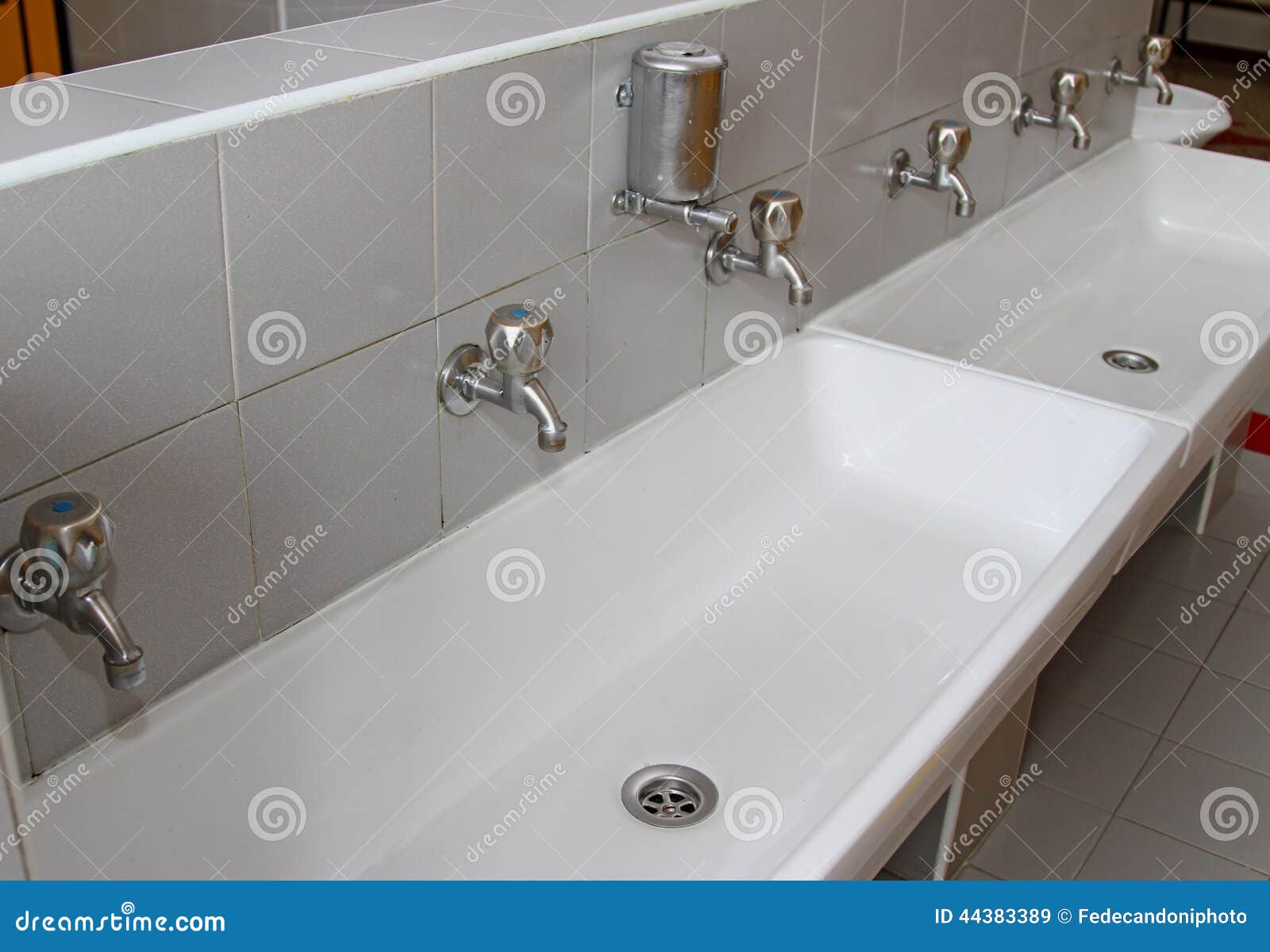 Sinks and Washbasins with Taps in the Toilets of a Nursery Stock Image