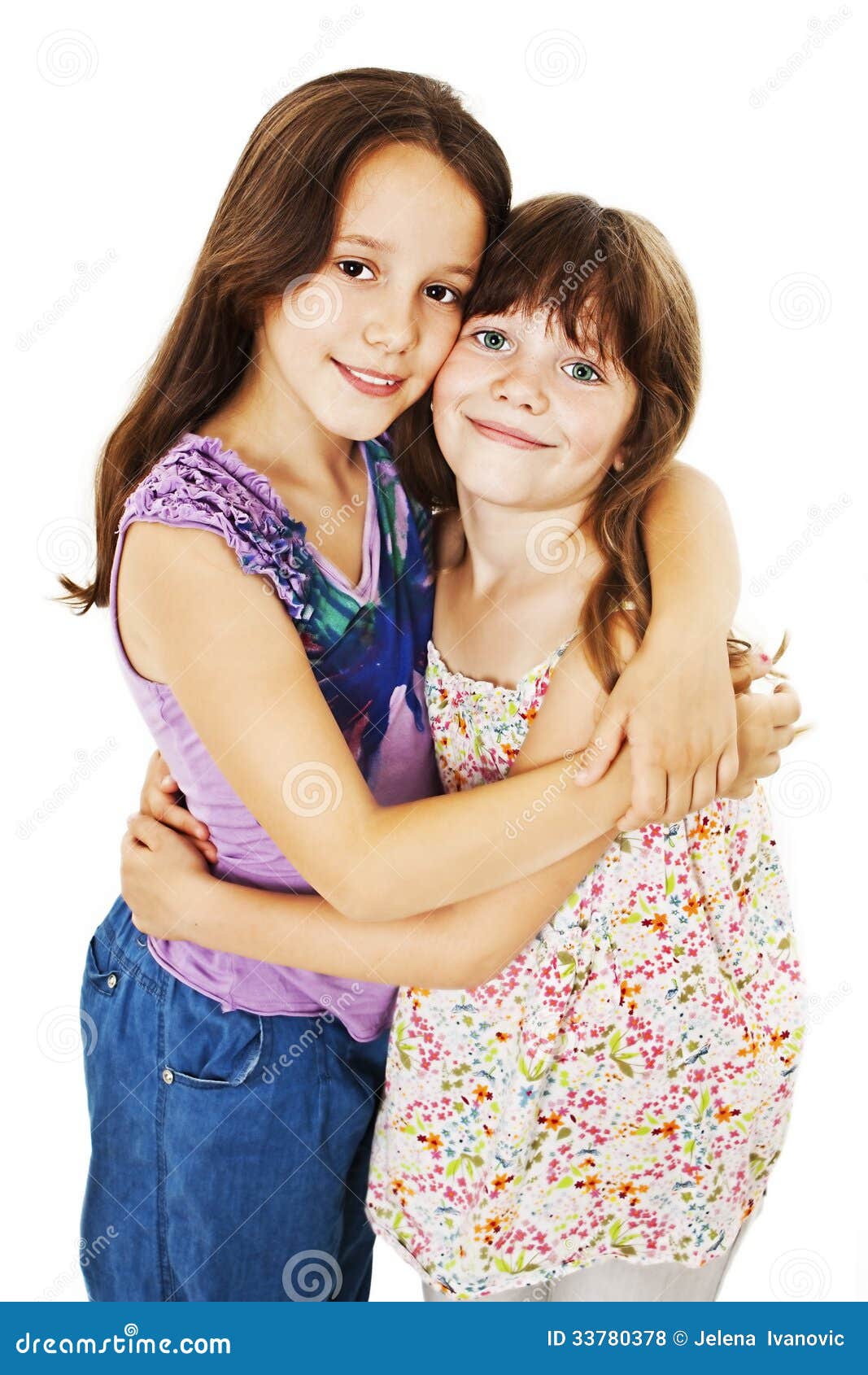 Two Sisters Hugging And Smiling High-Res Stock Photo 