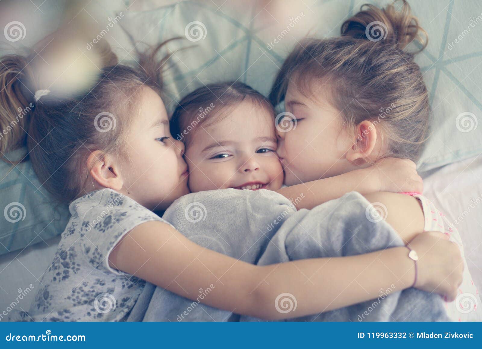 Sisters love. Kids in bed. stock photo. Image of little - 119963332