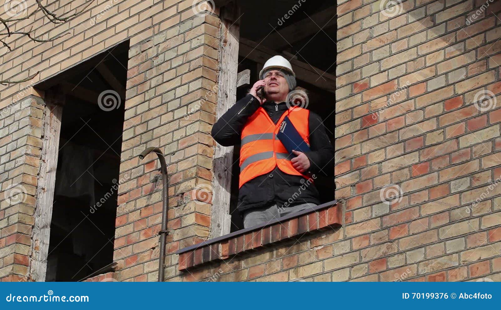 Site Manager Talking On Smart Phone In Building S Second Floor