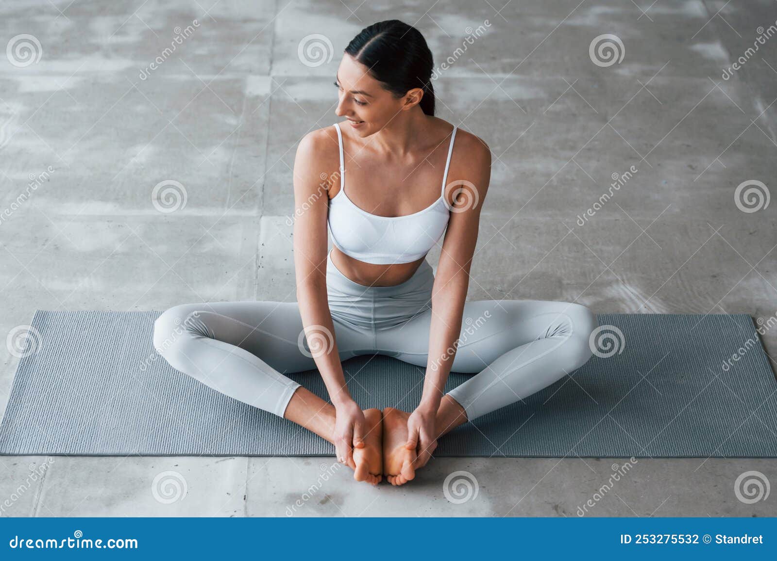 Sits on Yoga Mat. Woman with Sportive Slim Body Type in Underwear that is  in the Studio Stock Photo - Image of healthy, female: 253275532