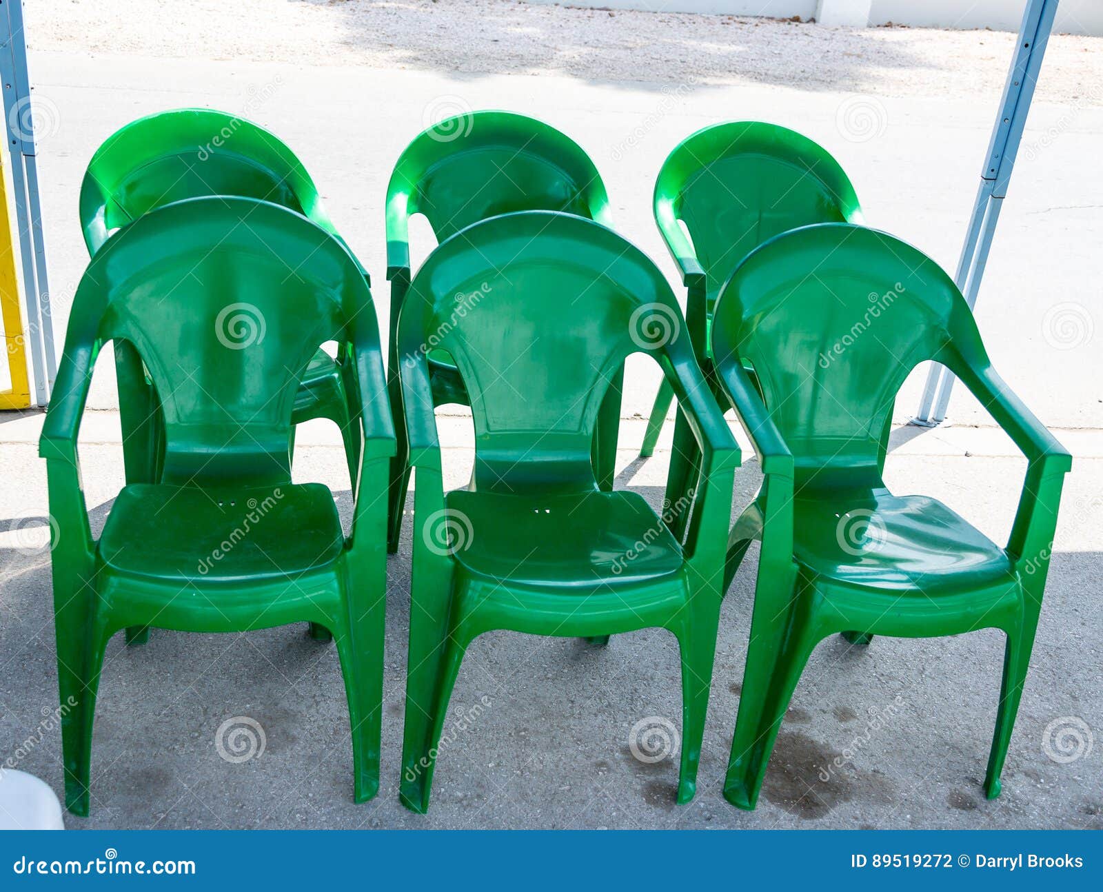 Six Green Plastic Chairs stock photo. Image of chair 89519272