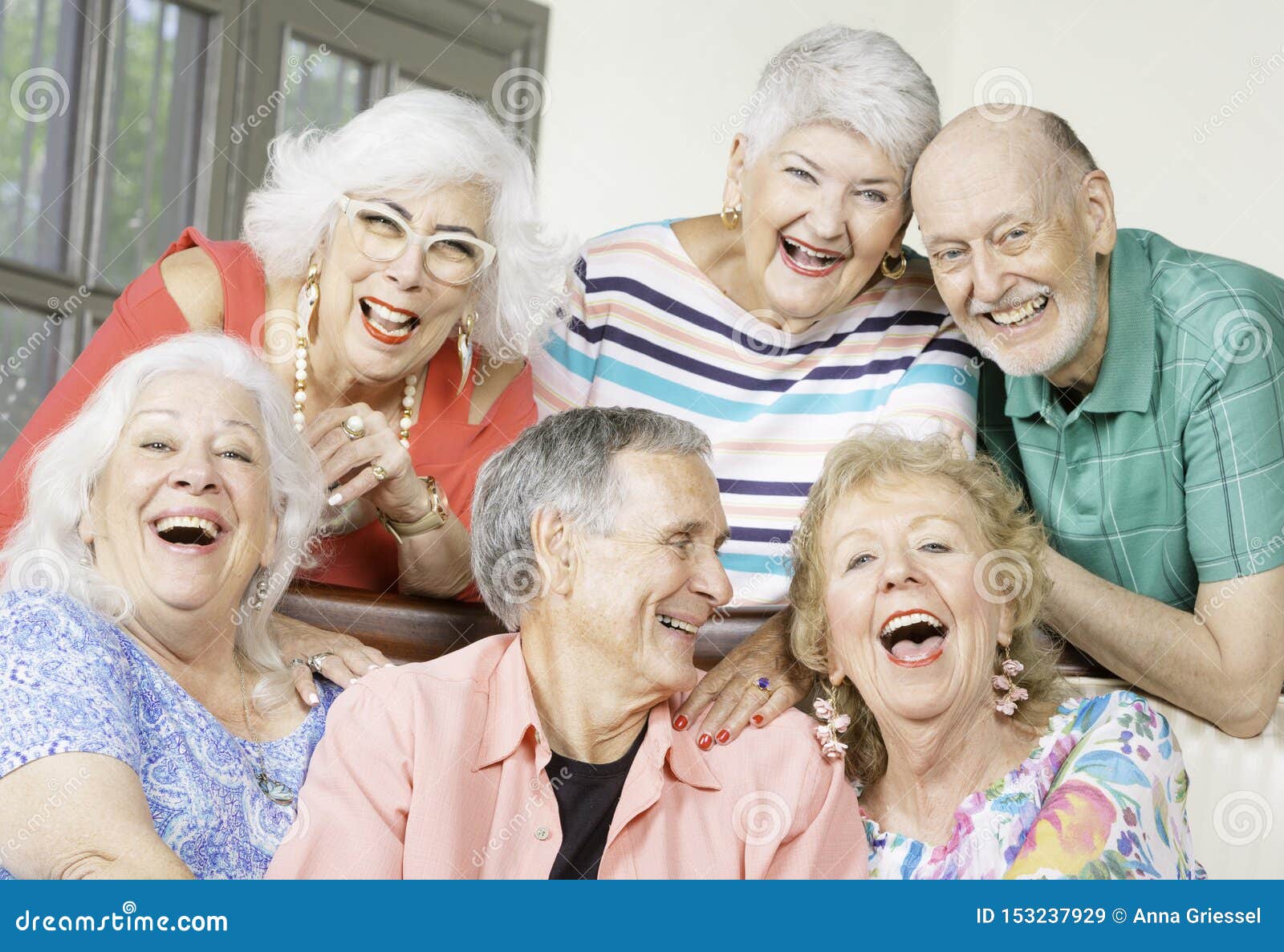 Six Laughing Senior Friends in a Living Room Stock Image Image of