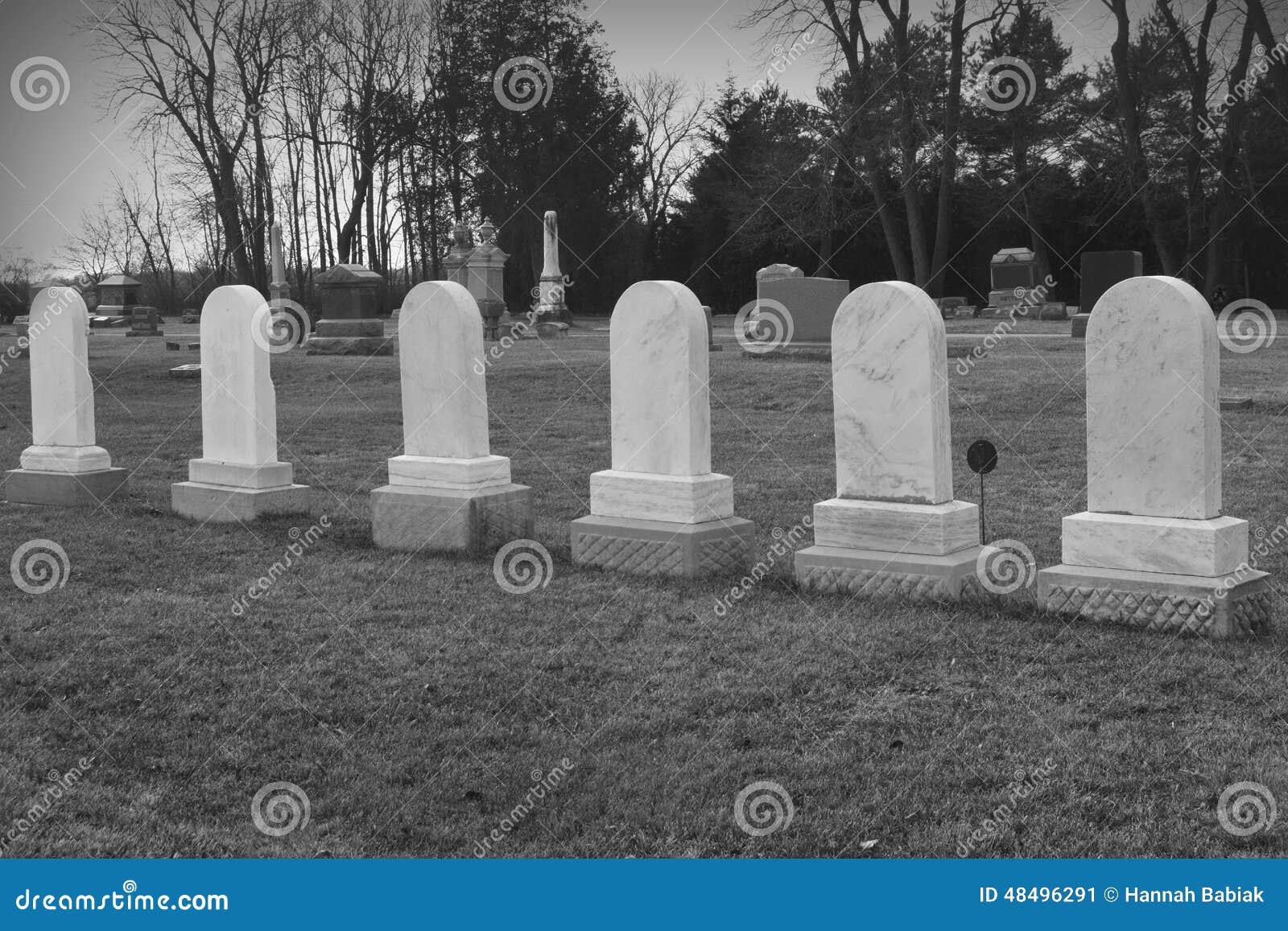 six matching tombstones in cemetary