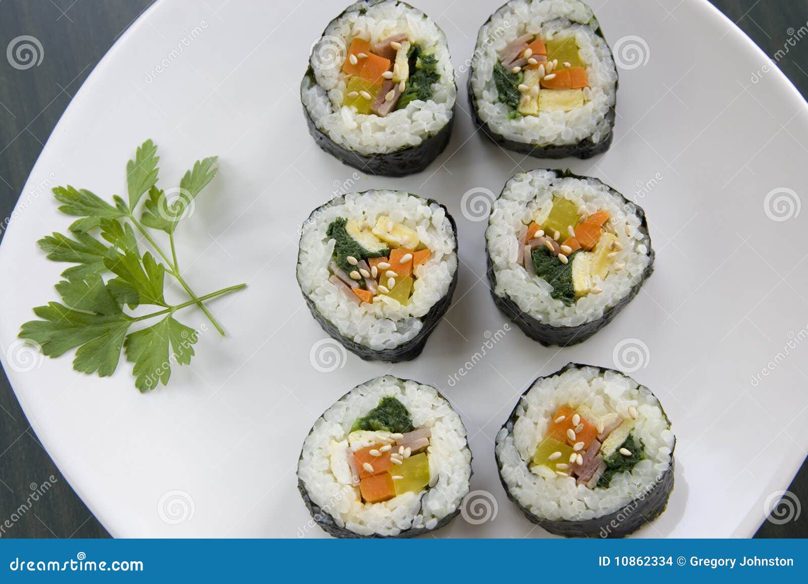 Six Pieces of Korean Sushi and a Parsley Leaf. Stock Photo Image of