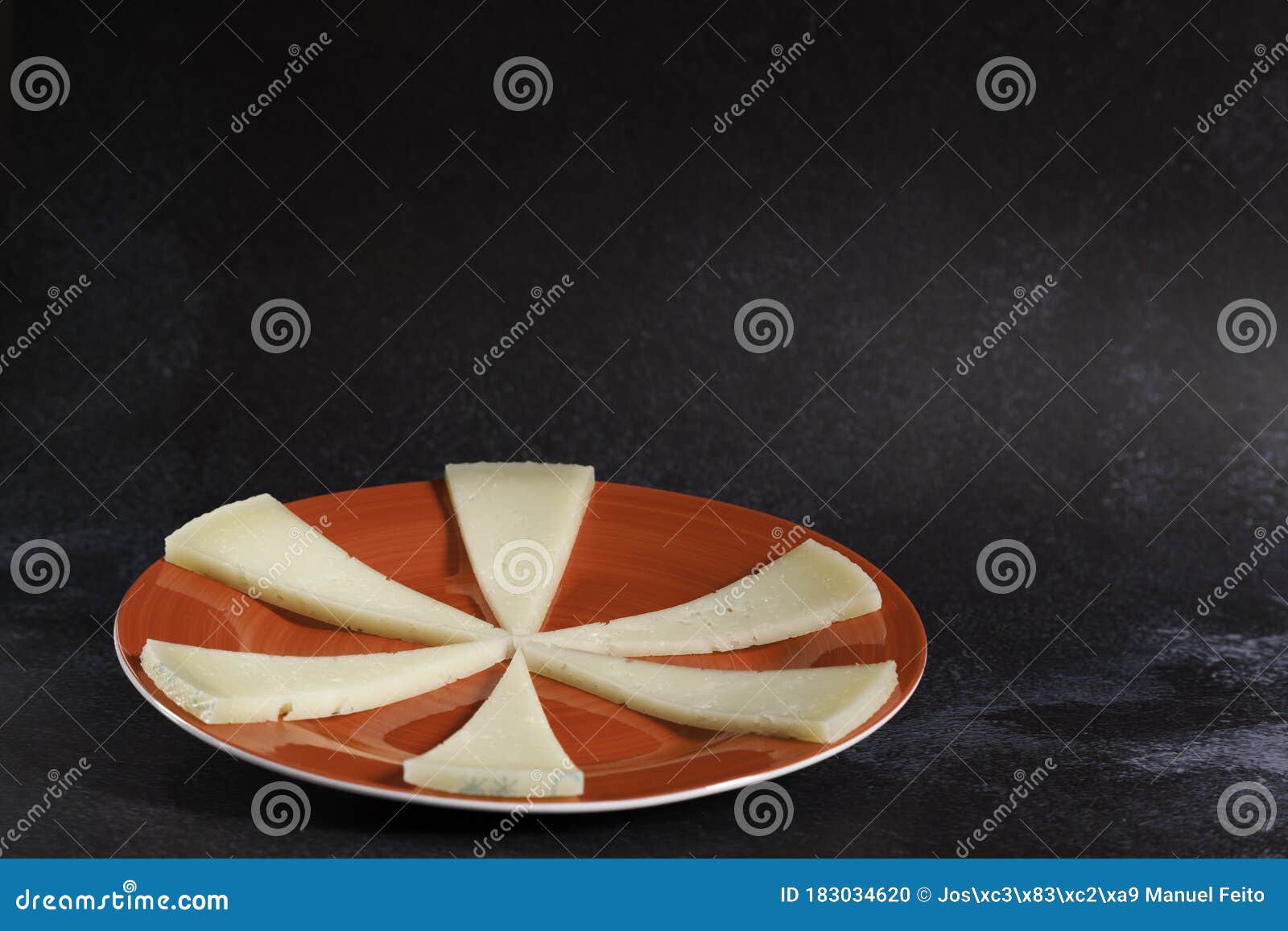 Six Slices of Typical Spanish Manchego Cheese on Red Ceramic Plate Stock Photo Image of copy