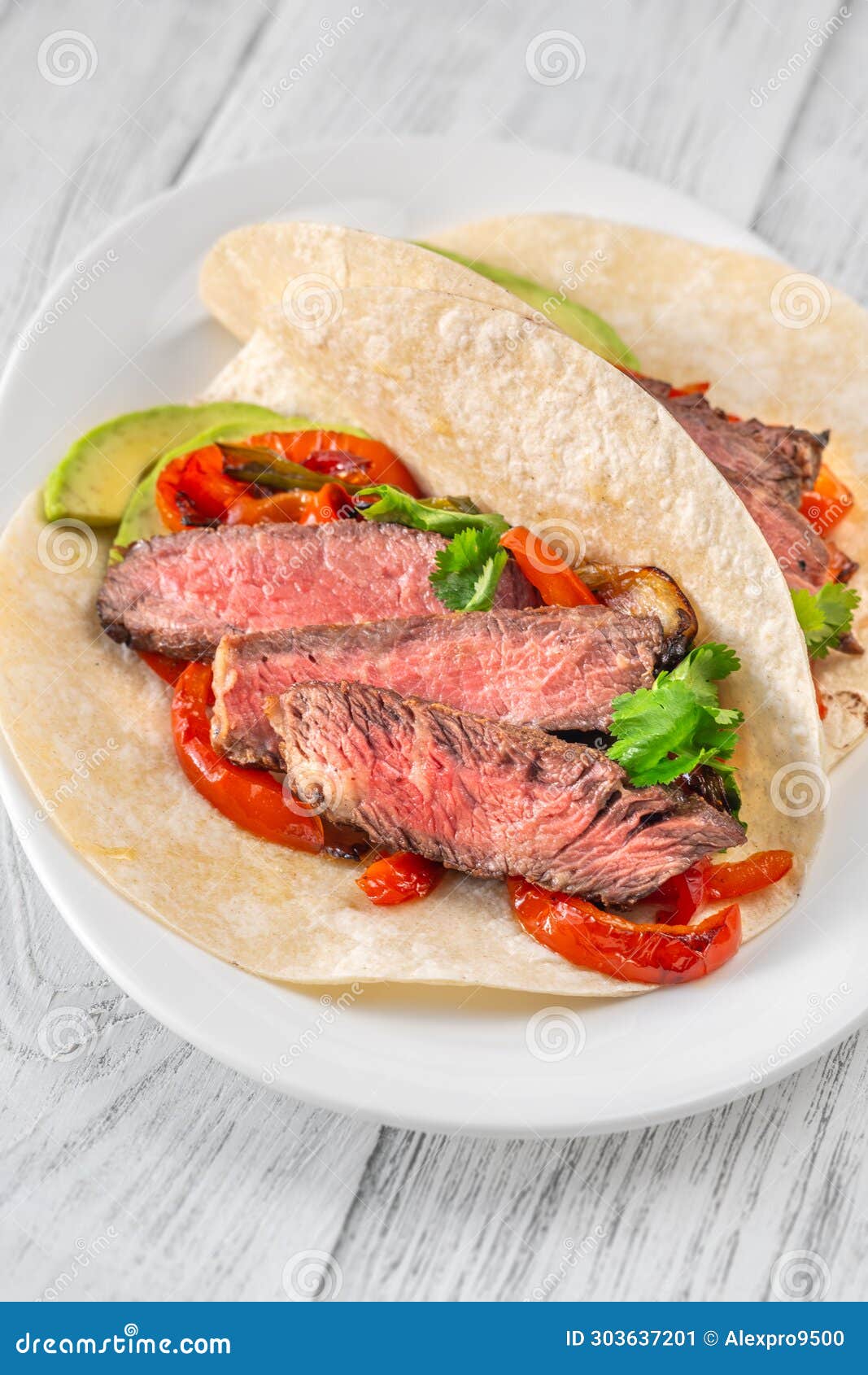 Sizzling Steak Fajitas stock image. Image of avocado 303637201