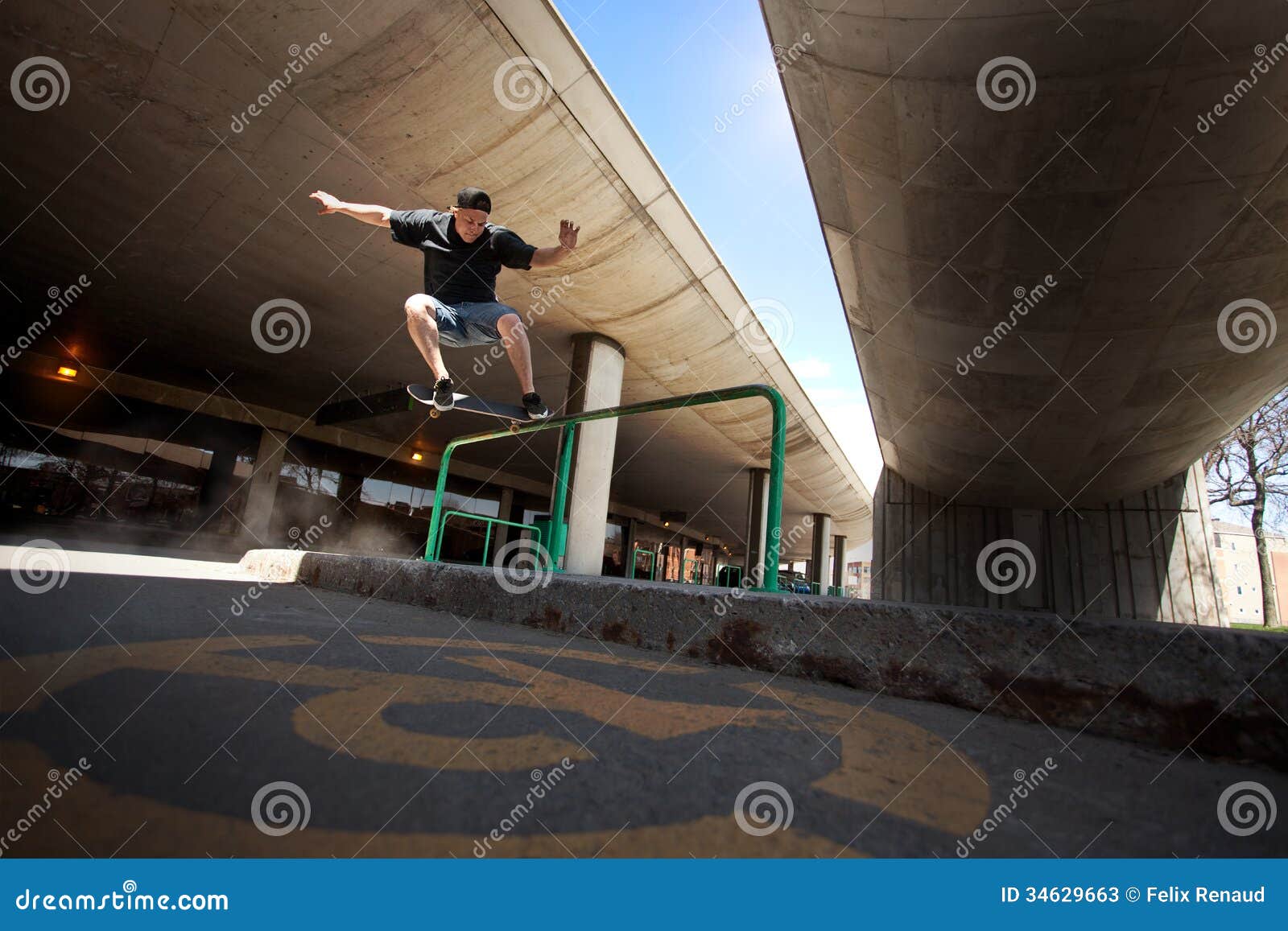 skateboarder doing a crooked grind trick on a rail